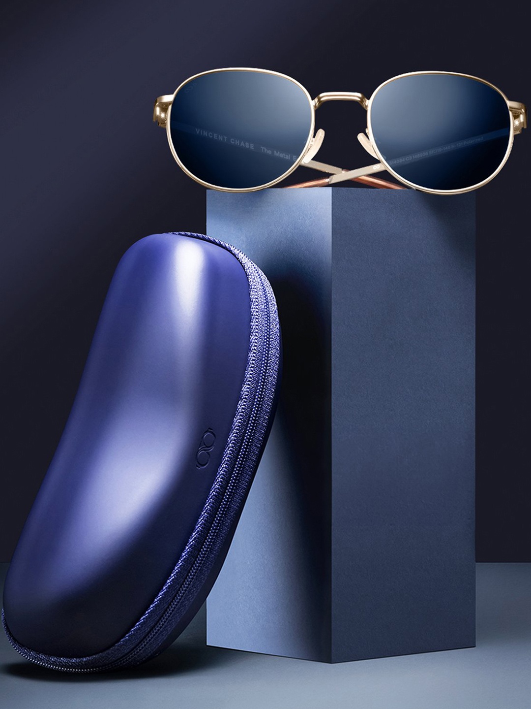 

Vincent Chase by Lenskart Unisex Blue Lens & Gold-Toned Round Sunglasses with Polarised Lens
