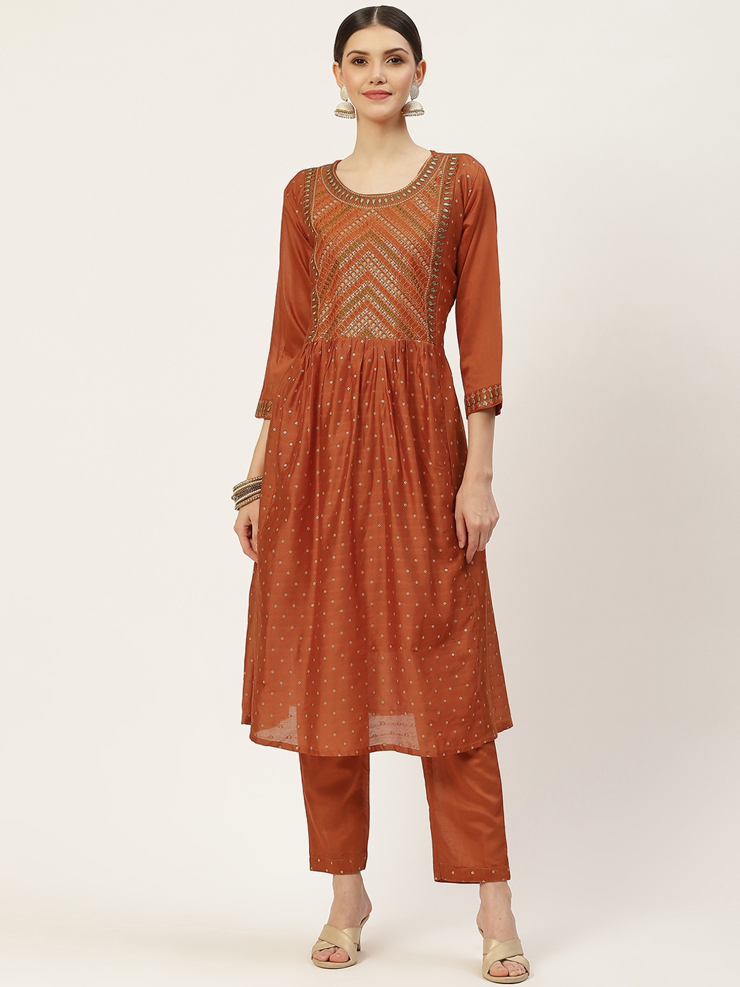 

SWAGG INDIA Women Rust Orange Embroidered Pleated Mirror Work Kurta with Trousers