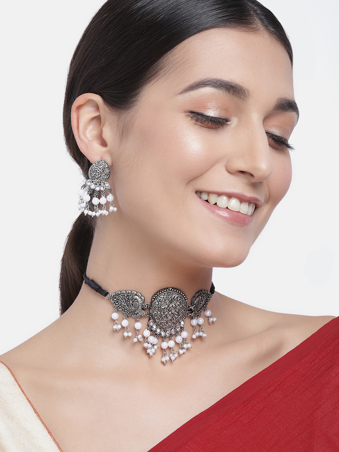 

Kord Store Silver-Plated & White Oxidized Beaded Peacock Shaped Choker Jewellery Set