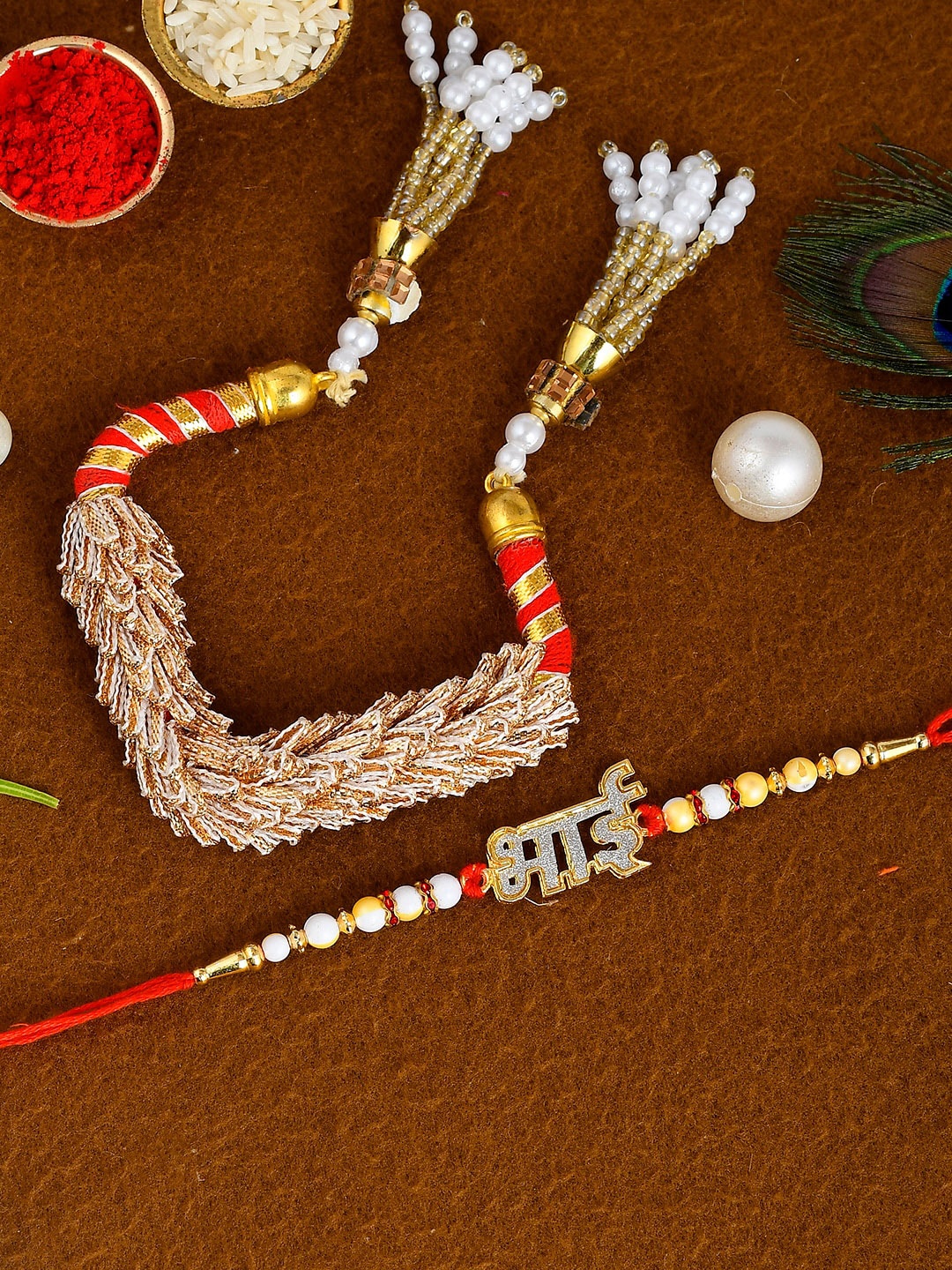

Shoshaa Set Of 2 Red & Gold-Toned Bhai Bhabhi Lumba & Rakhi