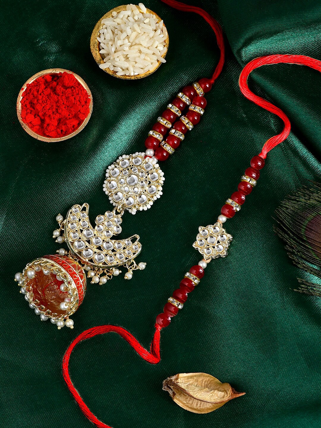 

Shoshaa 2 Pieces Designer Kundan Pearl beaded Bhai Bhabhi Rakhi Lumba Set, Red