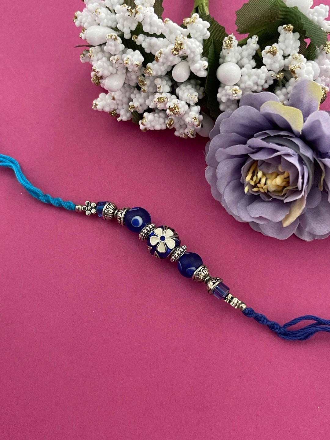 

Digital Dress Room Men Silver & Blue Floral Beaded Rakhi
