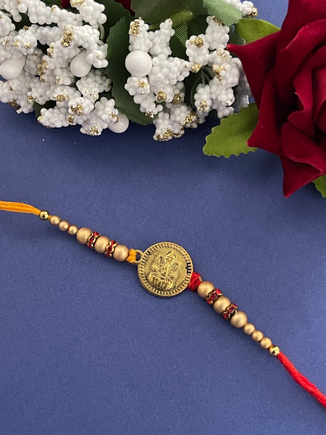 

Digital Dress Room Men Gold-Toned & Red Beaded Rakhi