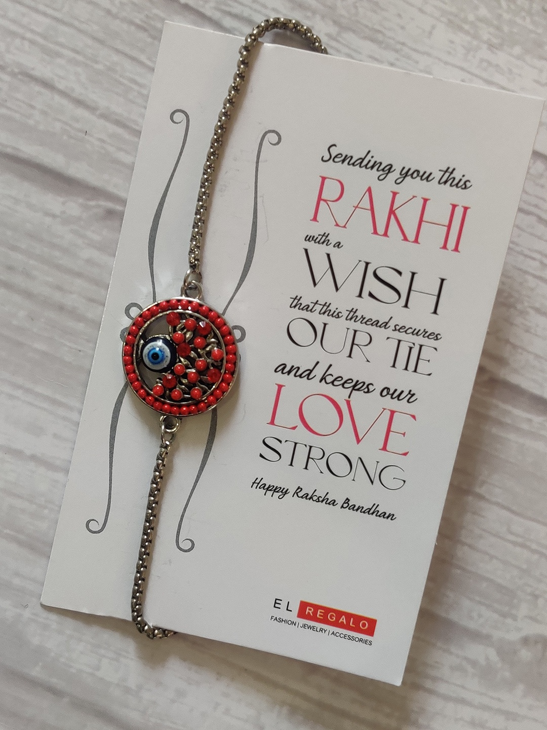 

EL REGALO Unisex SIlver-Plated Red Beaded Evil Eye Pendant Rakhi & Greeting Card Set