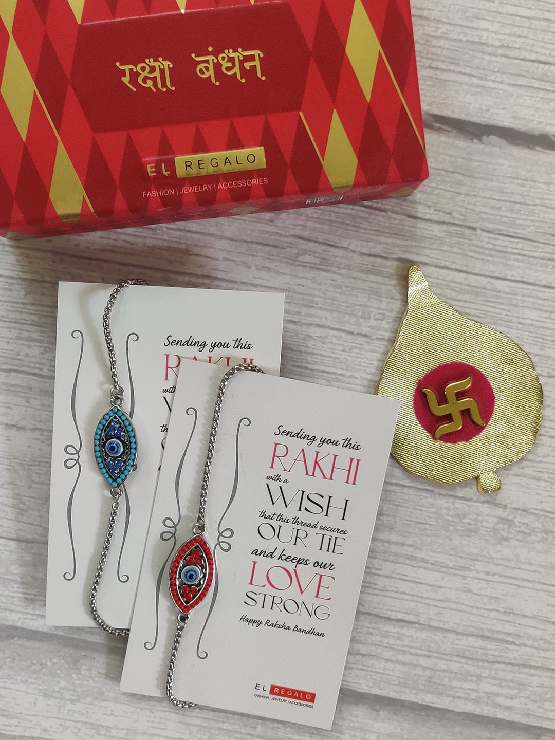 

EL REGALO Bhaiya Bhabhi Set of 2 Red Blue Rakhi with Greeting Card
