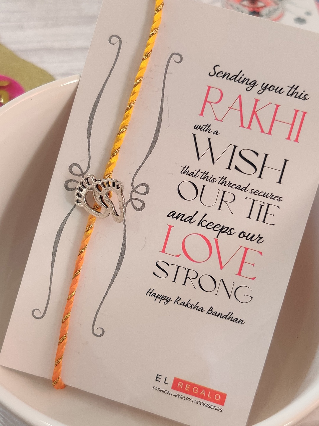 

EL REGALO Yellow 925 Silver Babys Feet Rakhi with Greeting Card and Roli Chawal Shagun