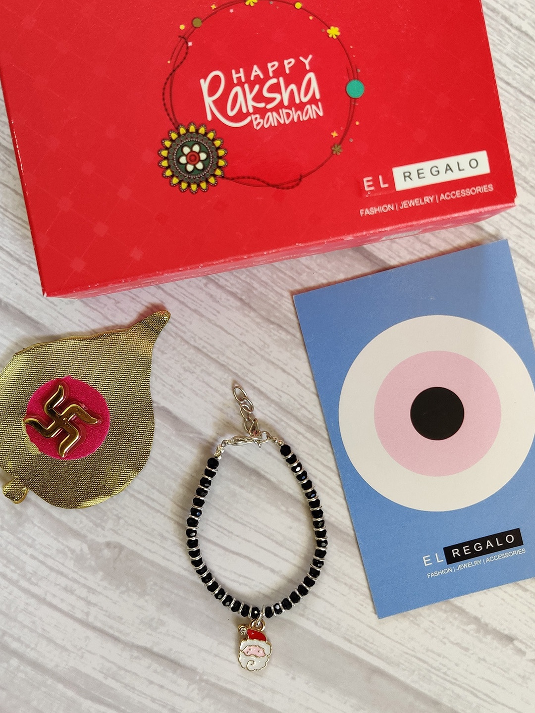 

EL REGALO Kids baby Nazaria Evil Eye Rakhi Combo with Roli Chawal Shagun, Red