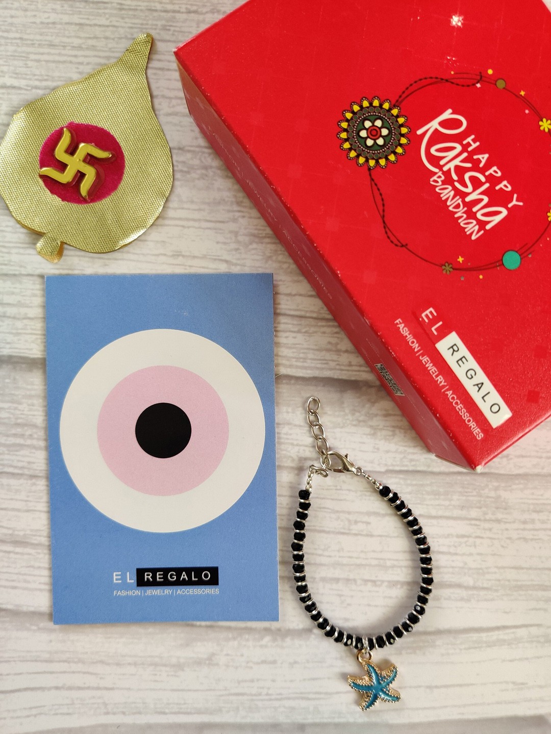 

EL REGALO Unisex Blue Nazaria Rakhi Combo with Greeting Card & Roli Chawal Shagun
