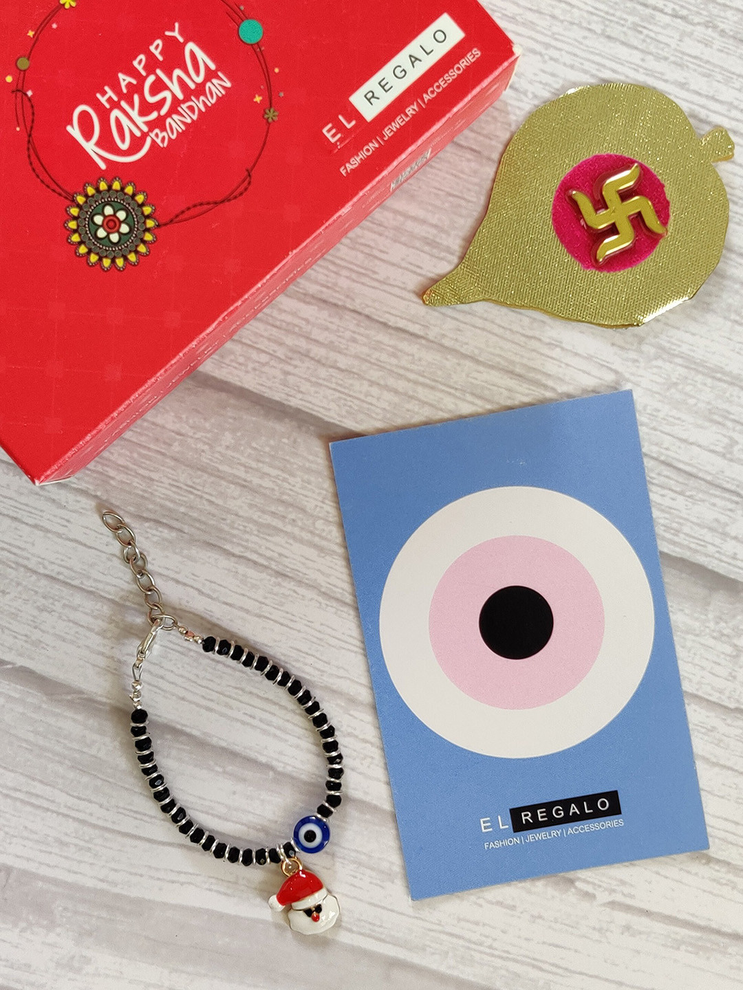 

EL REGALO Kids Red Nazaria Rakhi Combo with Greeting Card & Roli Chawal Shagun