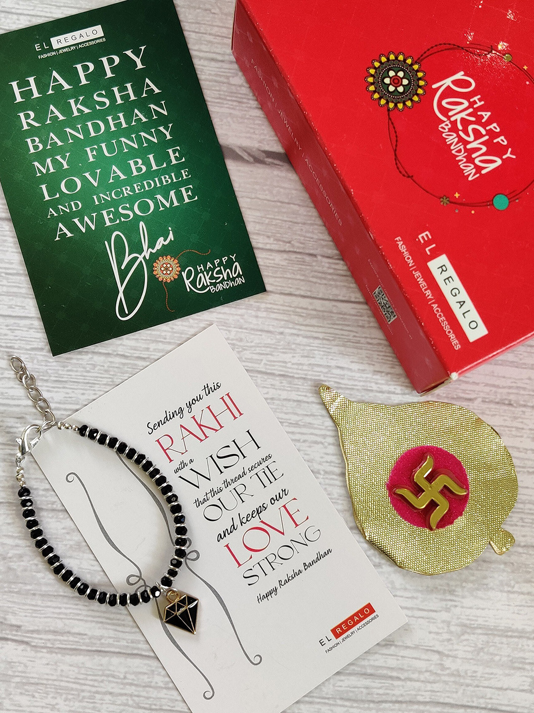 

EL REGALO Kids Black Nazaria Rakhi Combo with Greeting Card & Roli Chawal Shagun