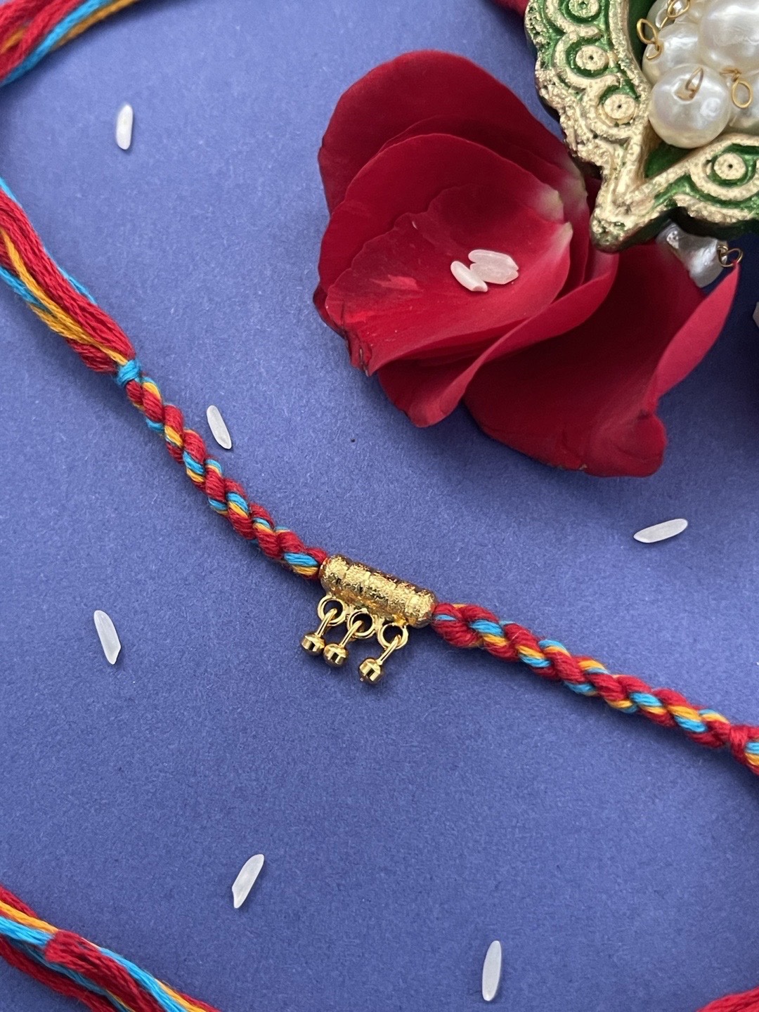 

Digital Dress Room Men Red Ghungroo Criss Cross Rakhi