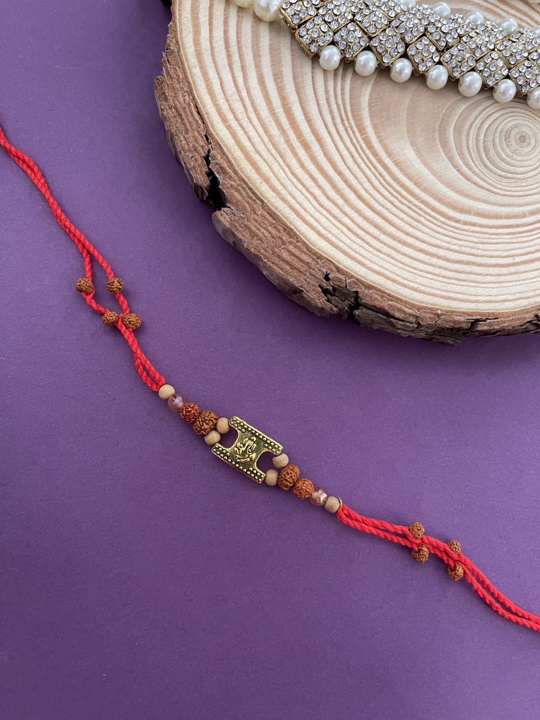 

Digital Dress Room Men Red & Gold Ganeshji Pedant Rudraksha Rakhi