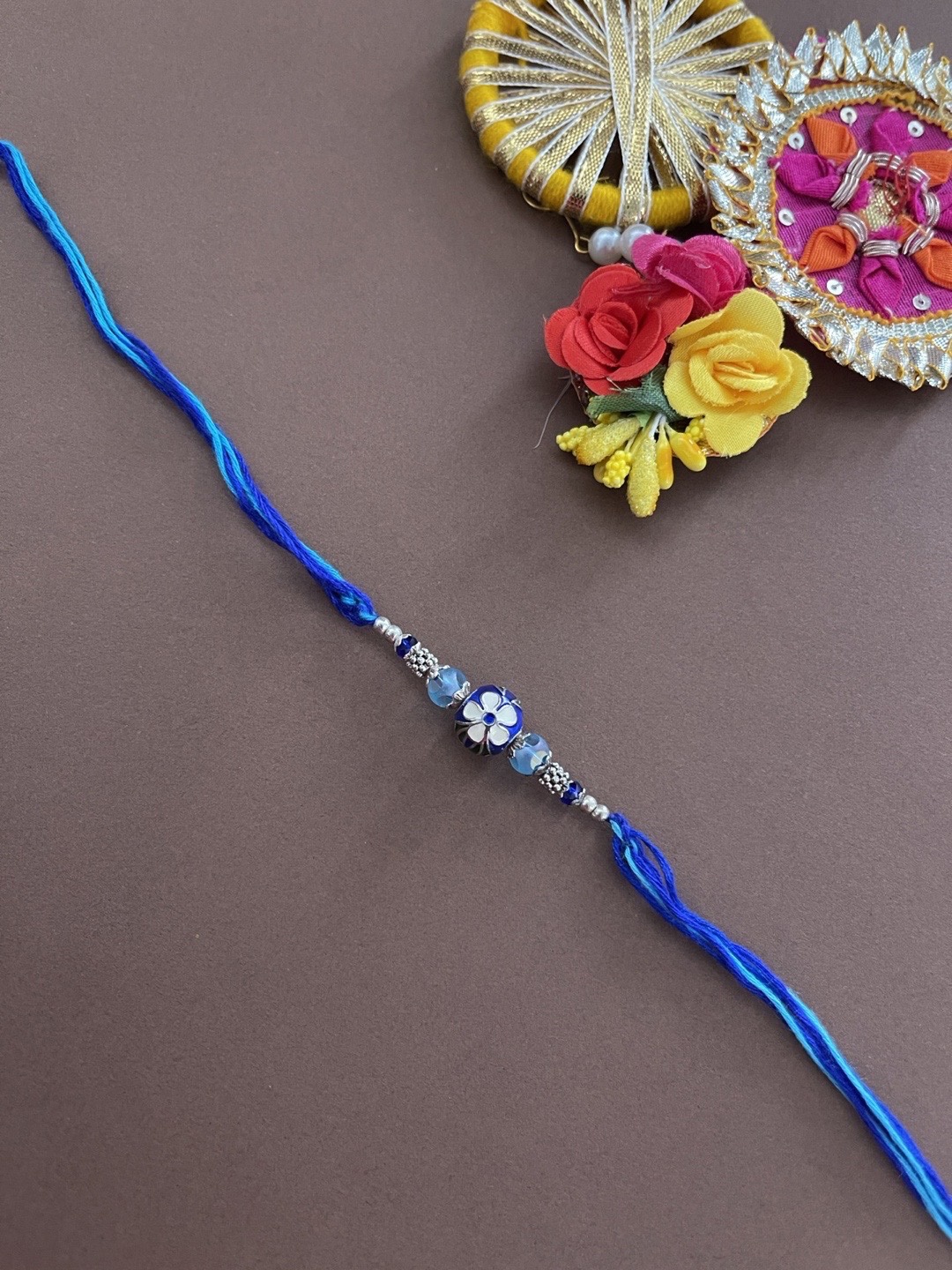 

Digital Dress Room Men Blue Meenakari Kundan Beaded Rakhi