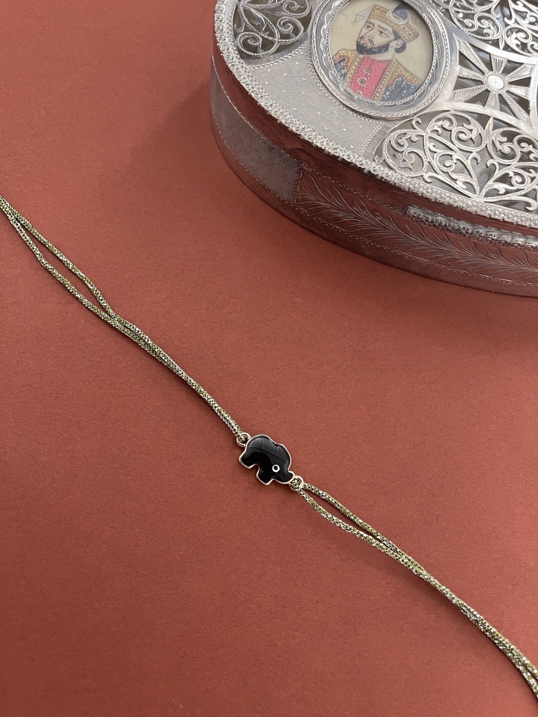 

Digital Dress Room Men Black Evil-Eye designed Green Thread Rakhi