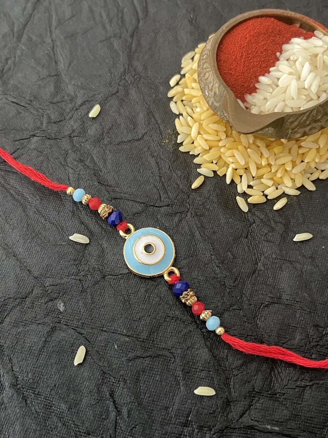 

Digital Dress Room Men Blue & Red Evil Eye Pendant Rakhi
