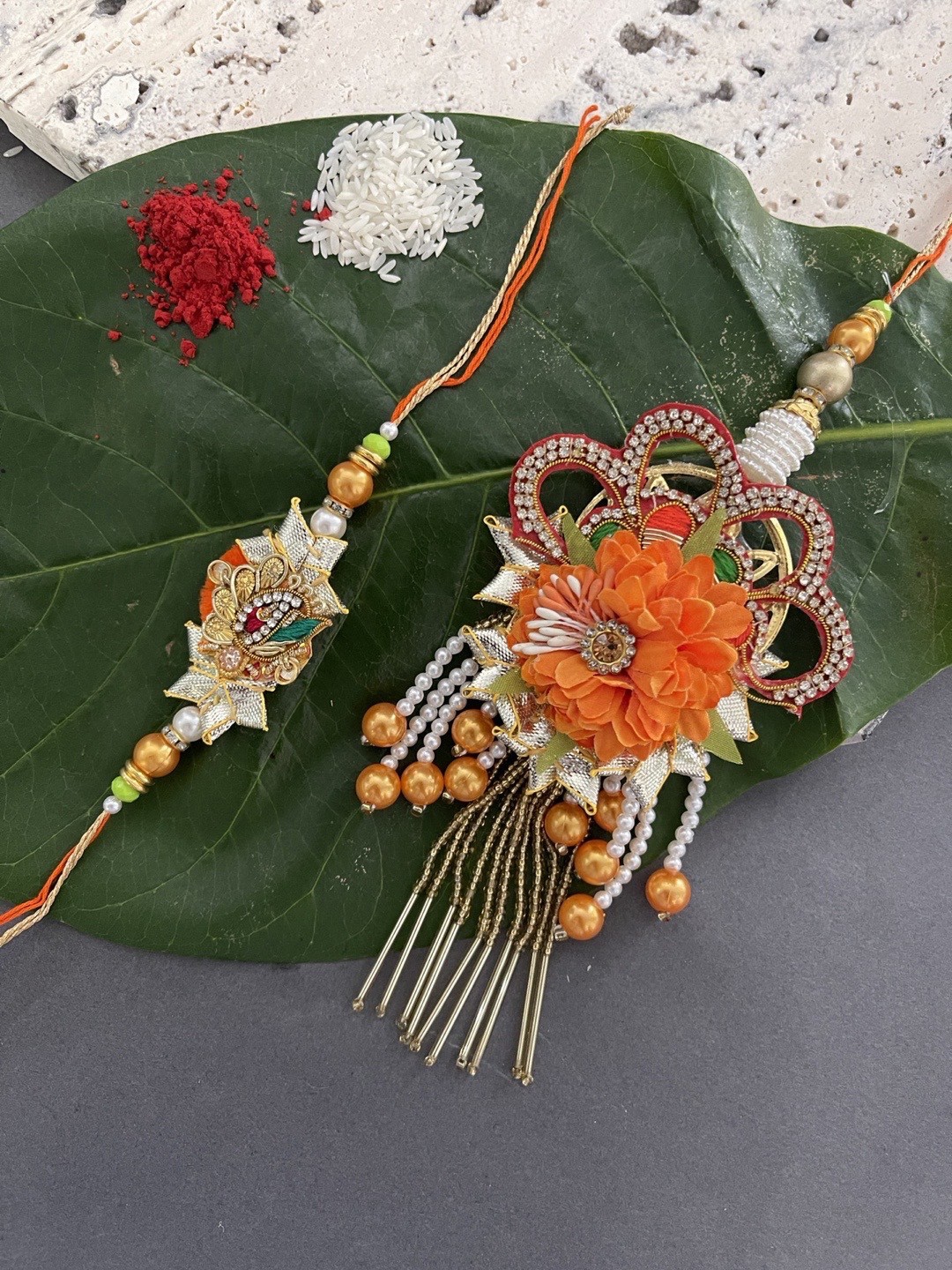 

Digital Dress Room Set of 2 Orange & White Floral Design Rakhi with Lumba