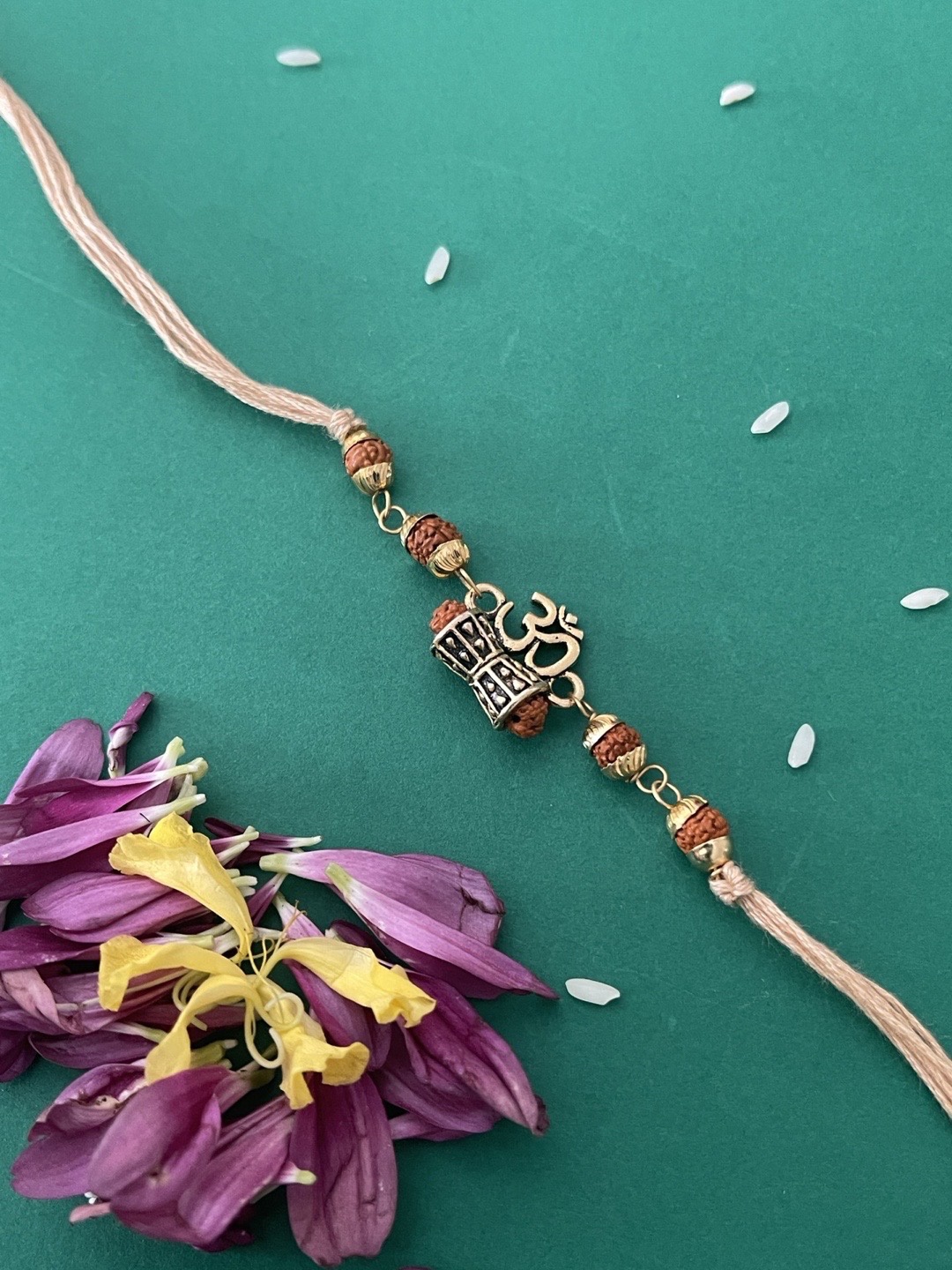 

Digital Dress Room Men Cream Colored Om Rudraksha Rakhi