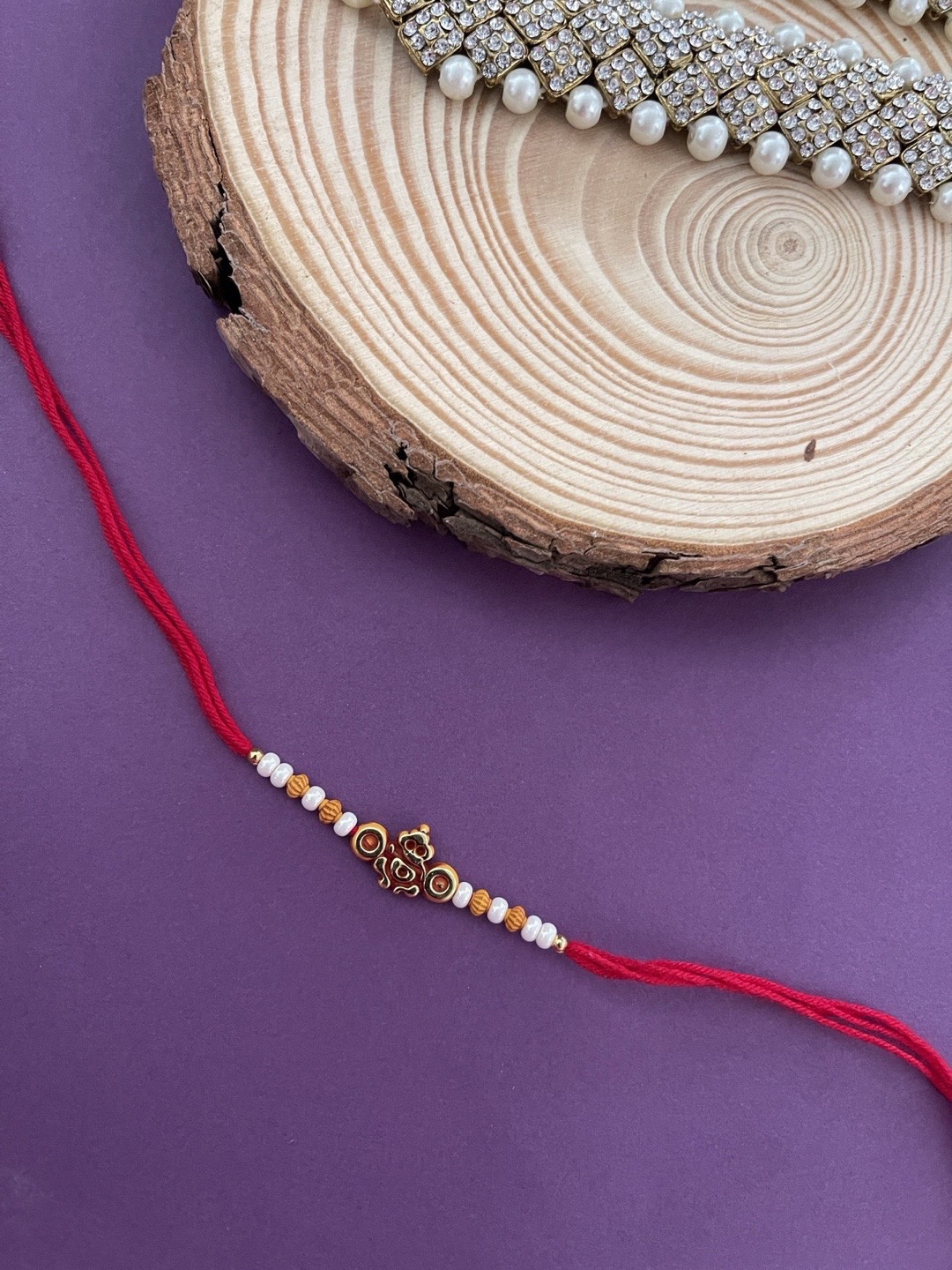 

Digital Dress Room Men Red & White Beaded Rakhi