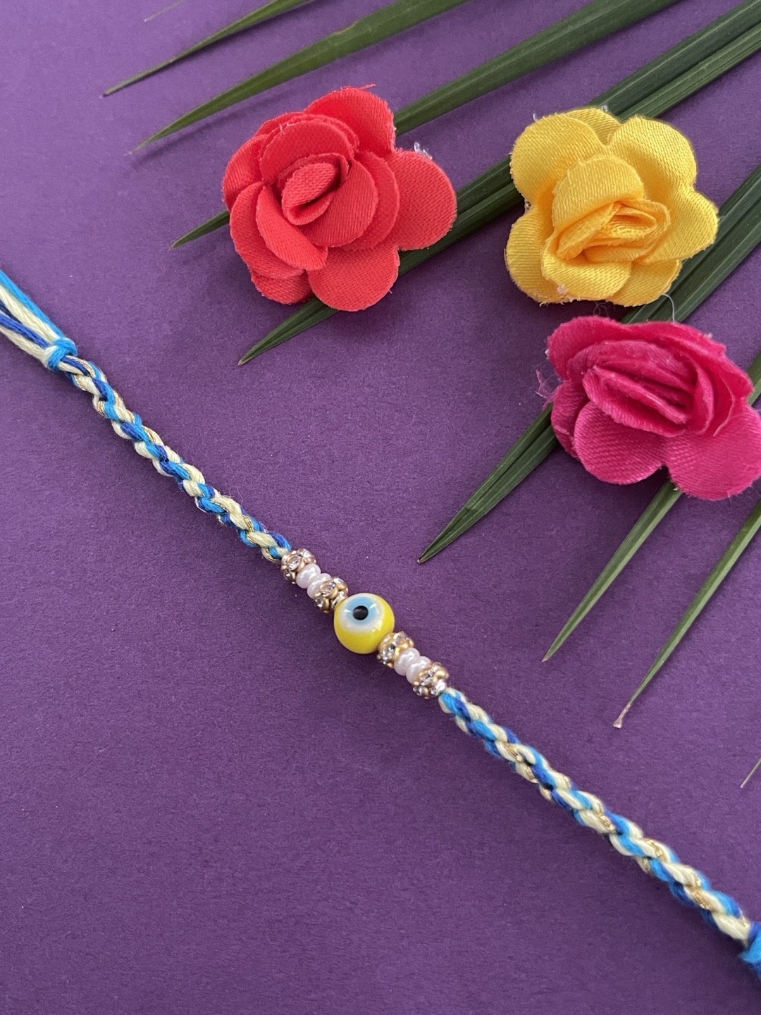 

Digital Dress Room Men Yellow & Blue Beaded Rakhi