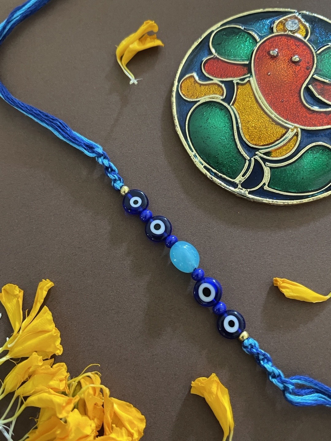 

Digital Dress Room Men Blue & White Evil Eye Pendant Glass Beaded Rakhi