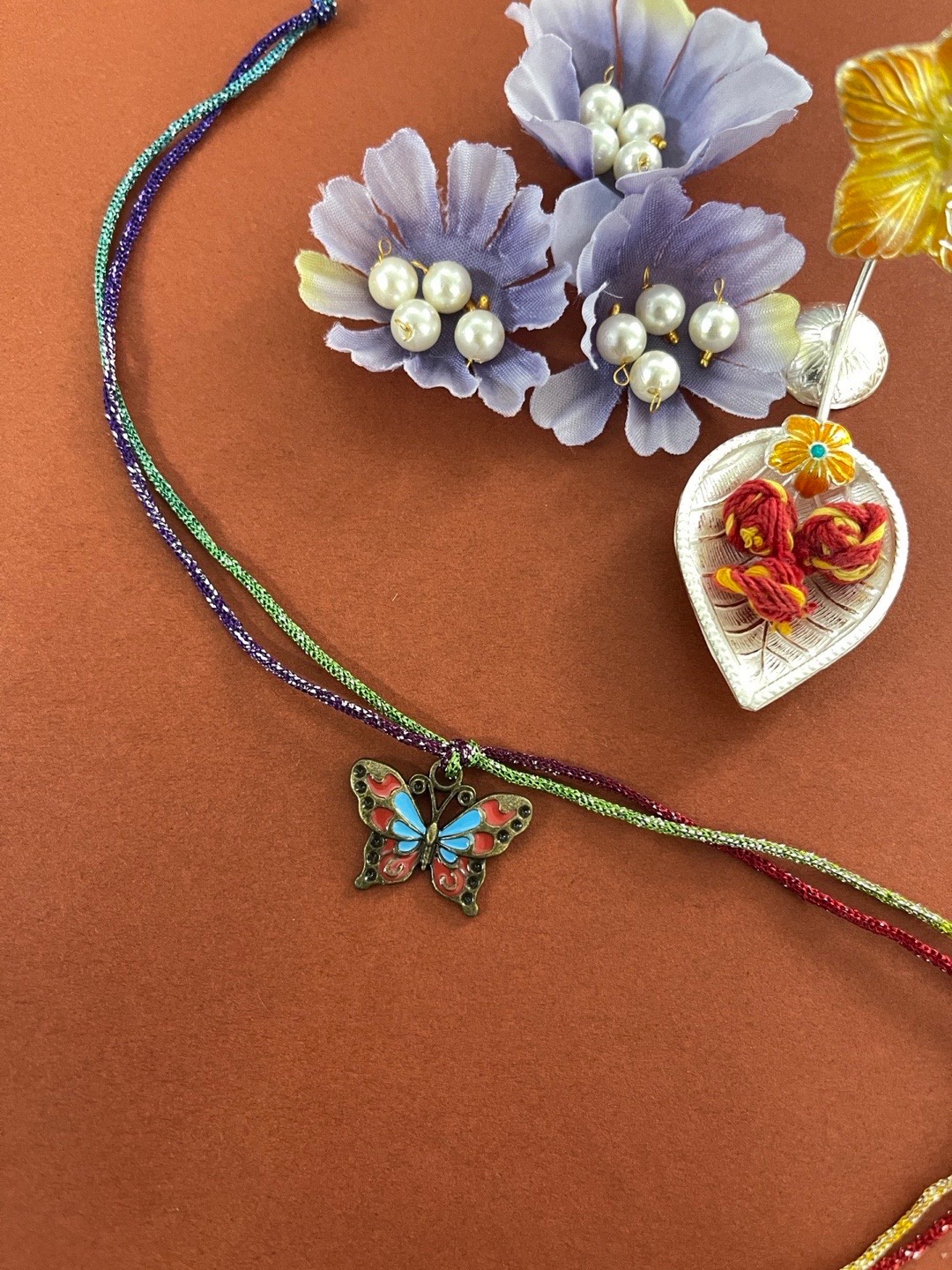 

Digital Dress Room Red & Blue Butterfly Rakhi