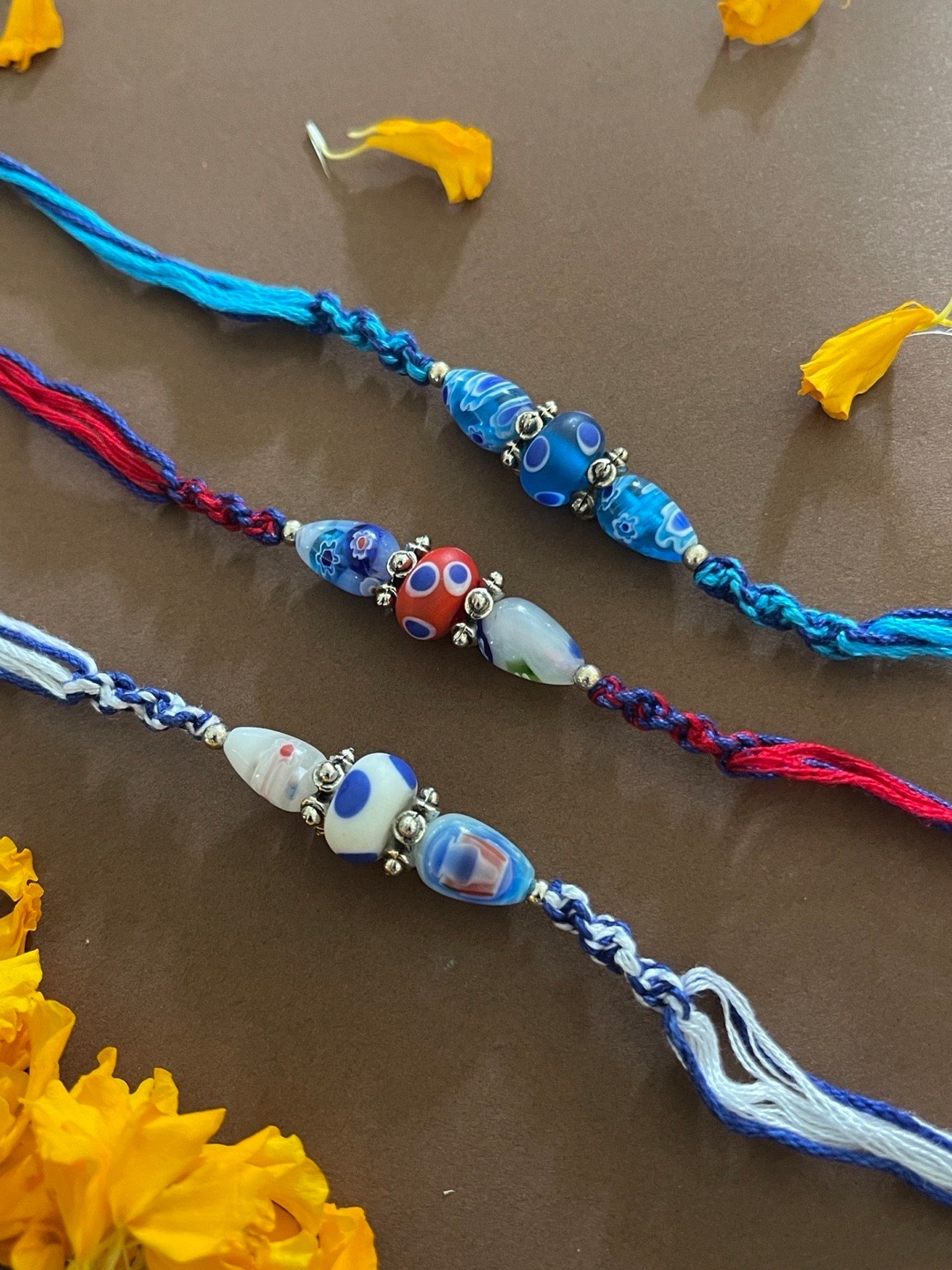 

Digital Dress Room Men Set Of 3 Beaded Rakhi With Roli, White