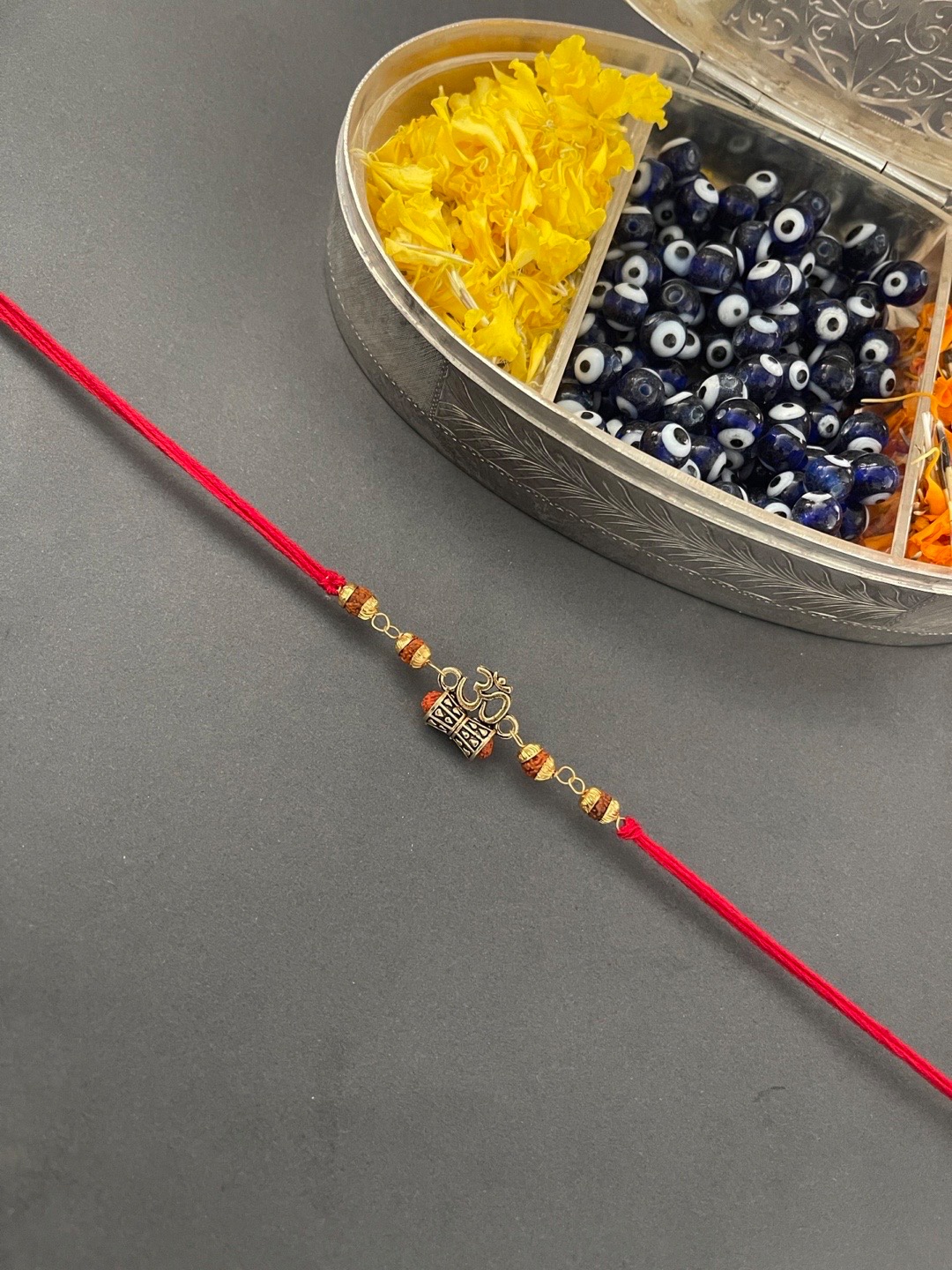 

Digital Dress Room Men Red & Gold-Toned Beaded Rakhi