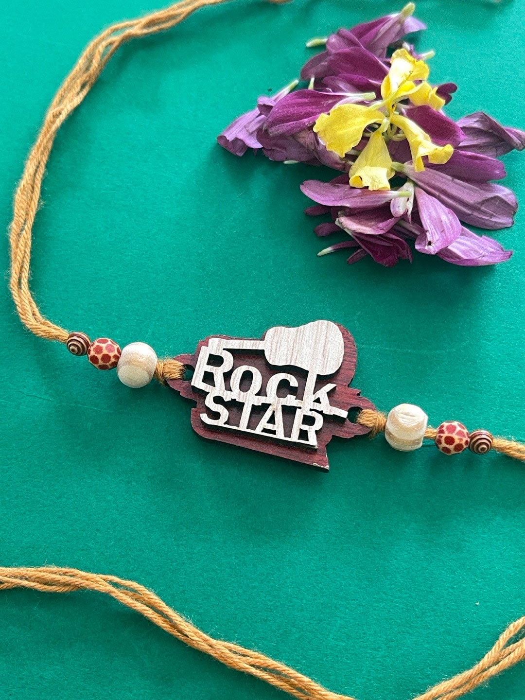 

Digital Dress Room Men Cream-Toned & White Beaded Rakhi