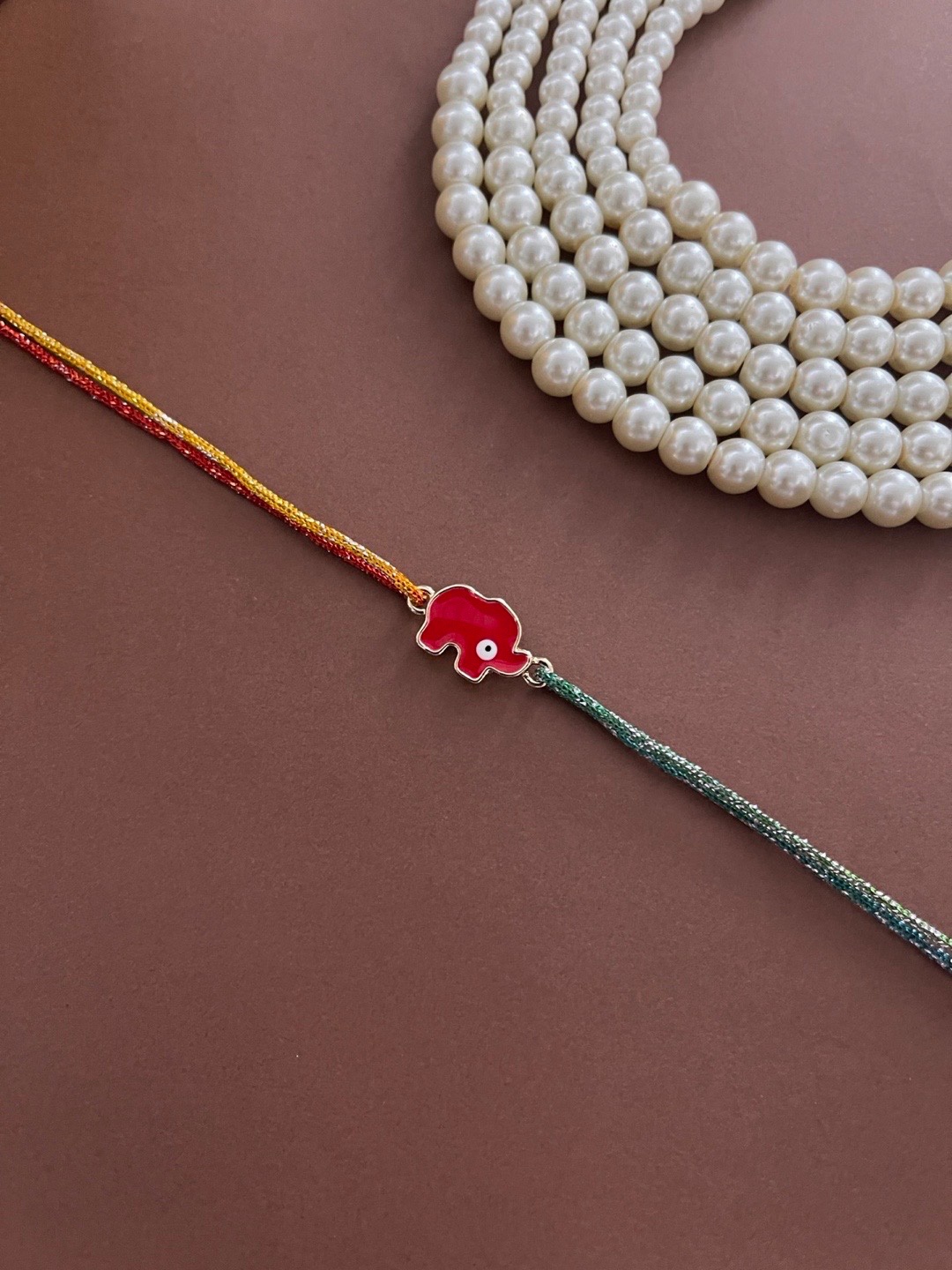 

Digital Dress Room Men Red Elephant Evil Eye Charm Rakhi