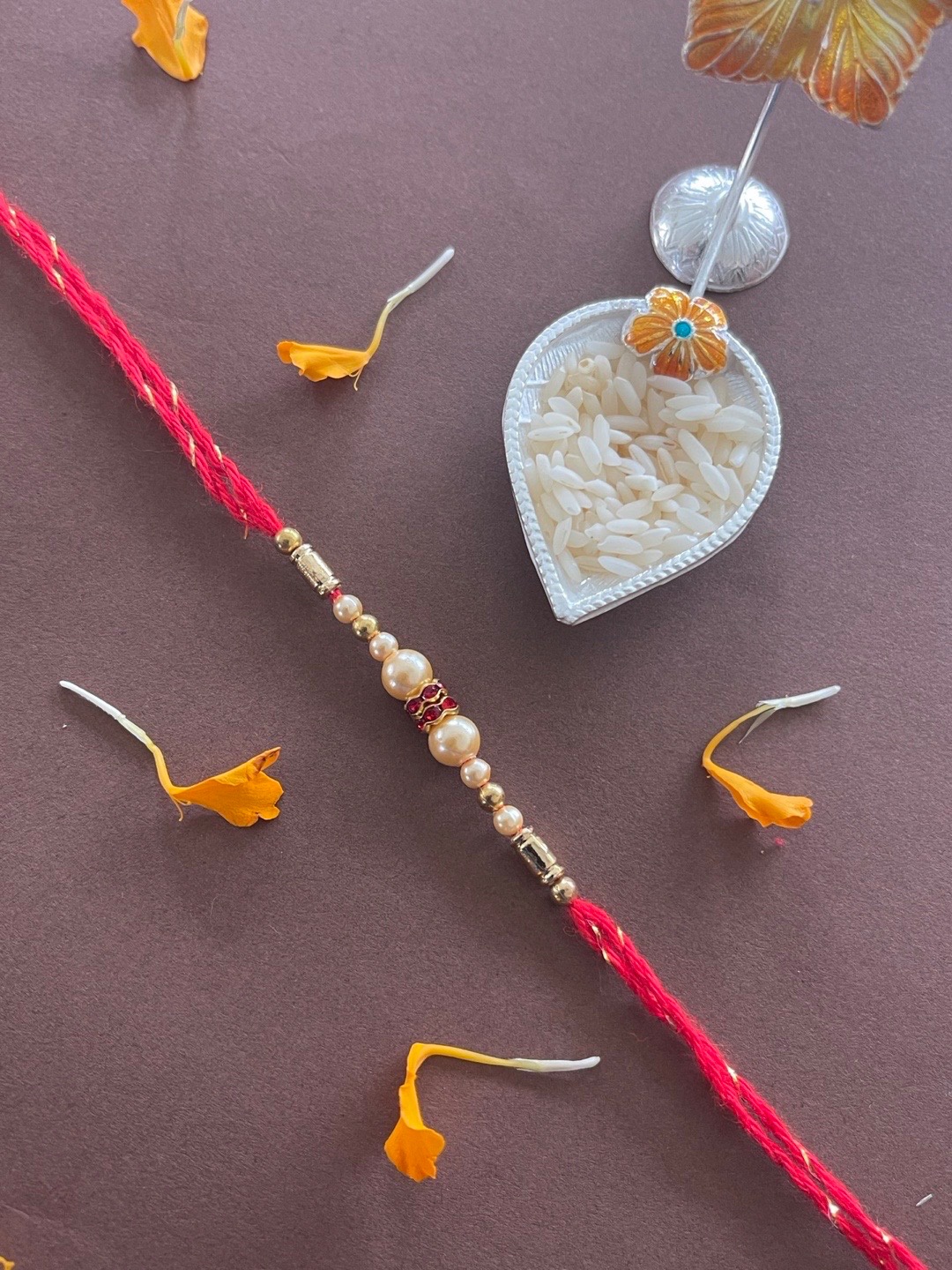 

Digital Dress Room Men Red & White Pearl Beaded Rakhi