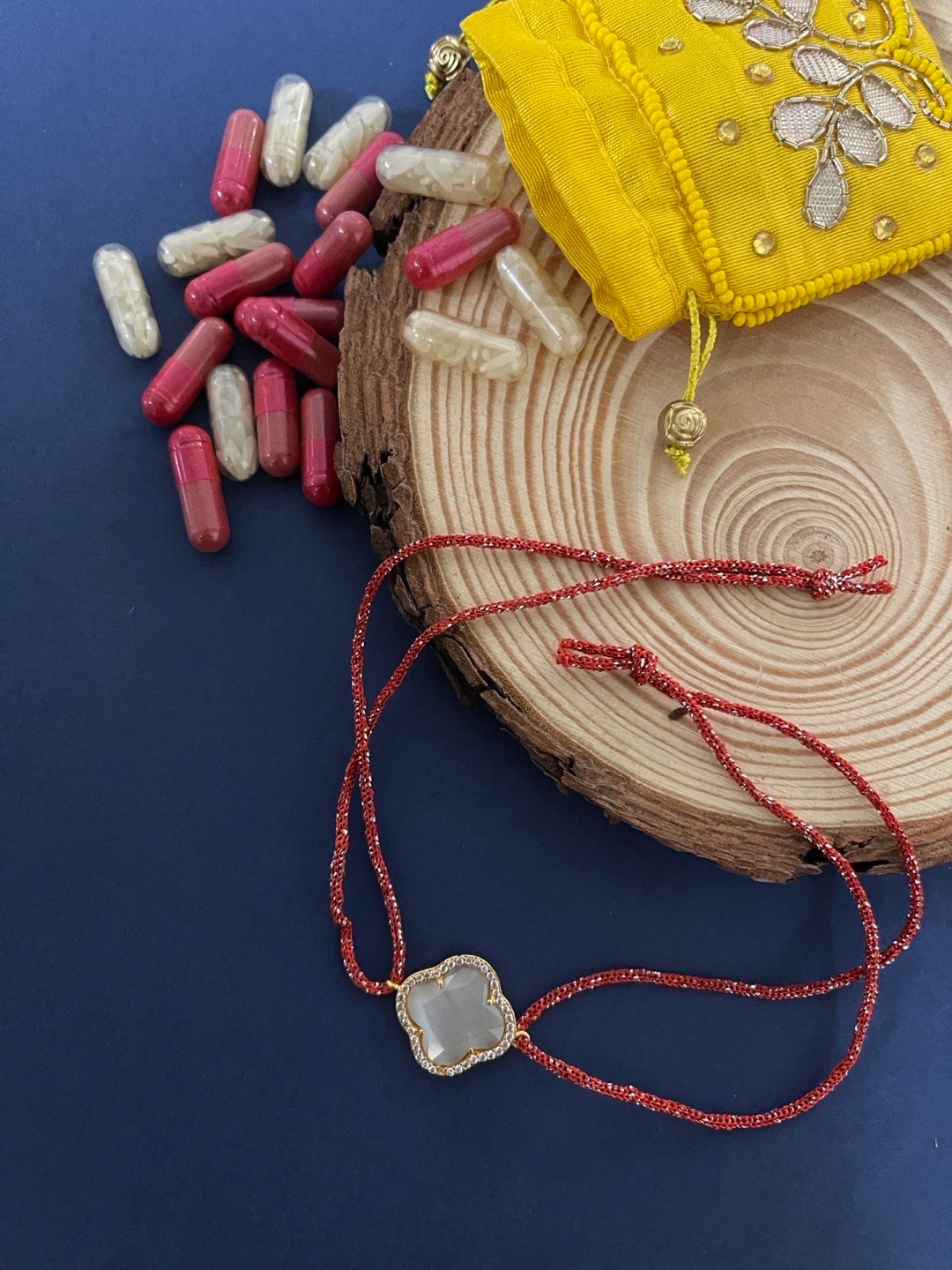 

Digital Dress Room Men Red & Gold AD Studded Pendant Rakhi
