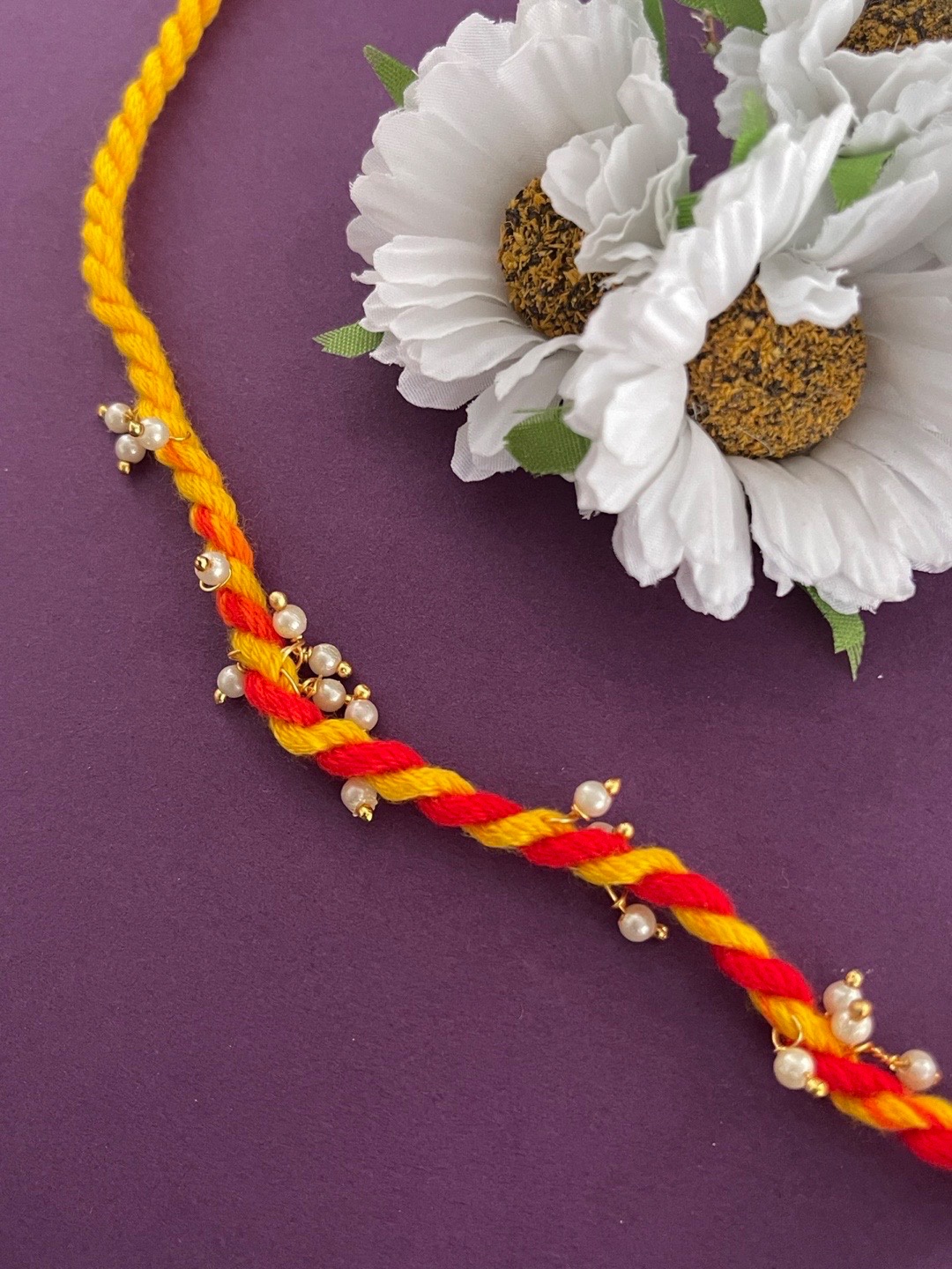 

Digital Dress Room Men White & Yellow Pearl Beaded Thread Rakhi, Red