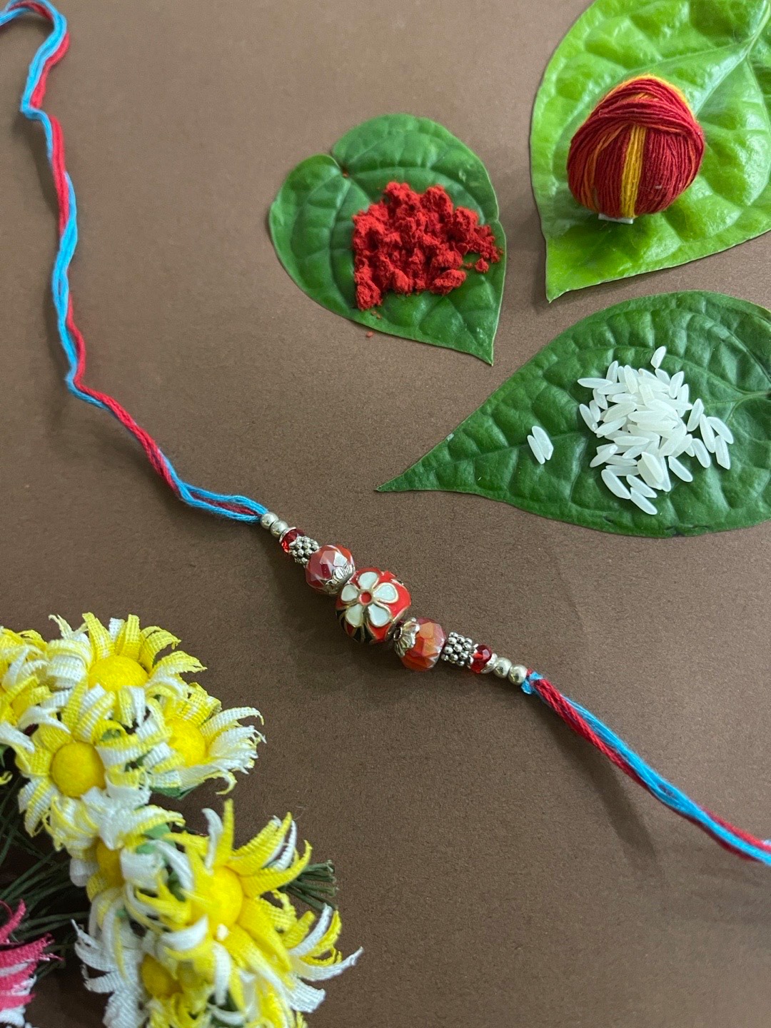 

Digital Dress Room Men Red & Blue Kundan Beaded Meenakari Rakhi