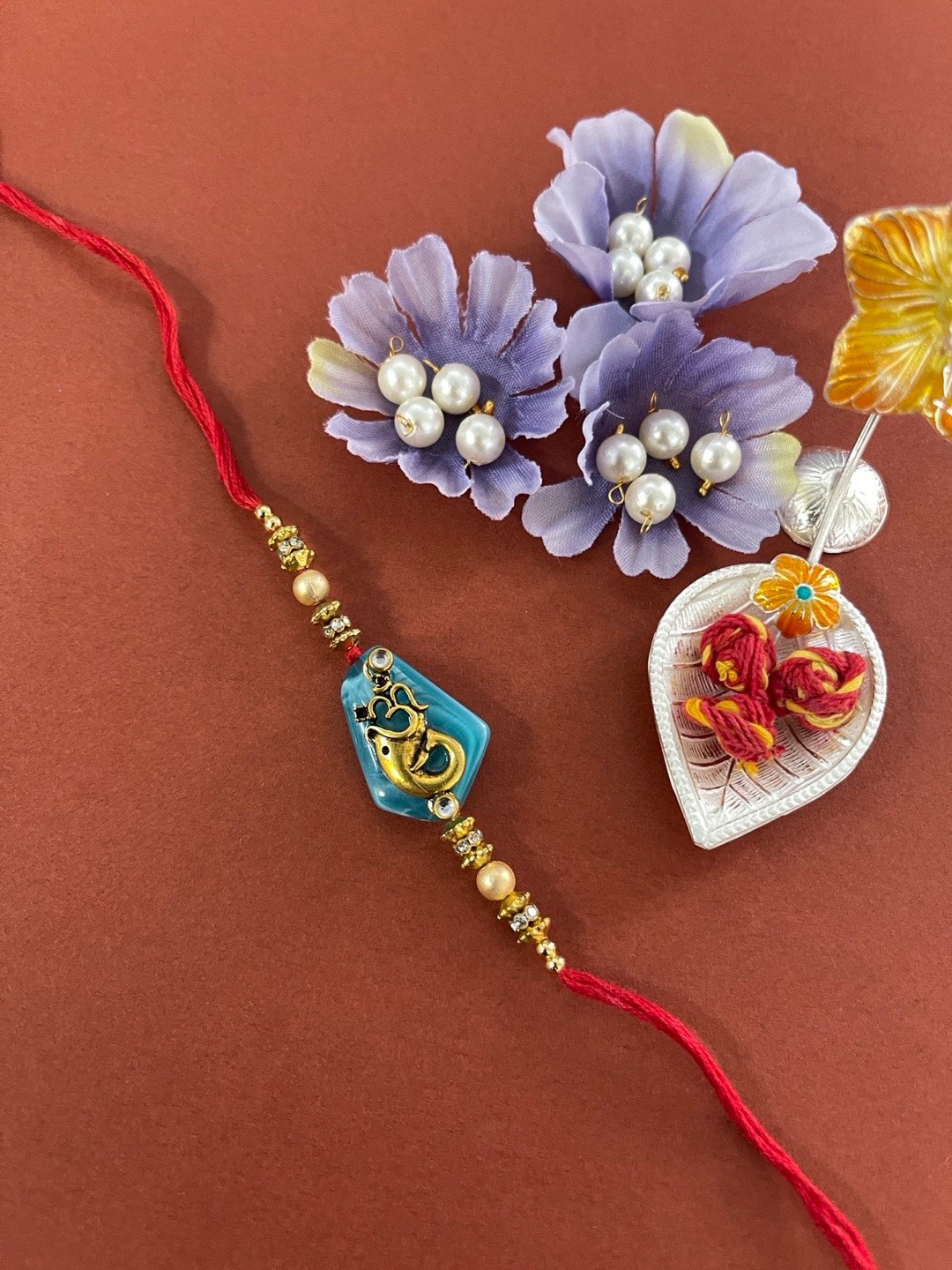 

Digital Dress Room Men Red & Gold-Toned Stone-Studded Rakhi