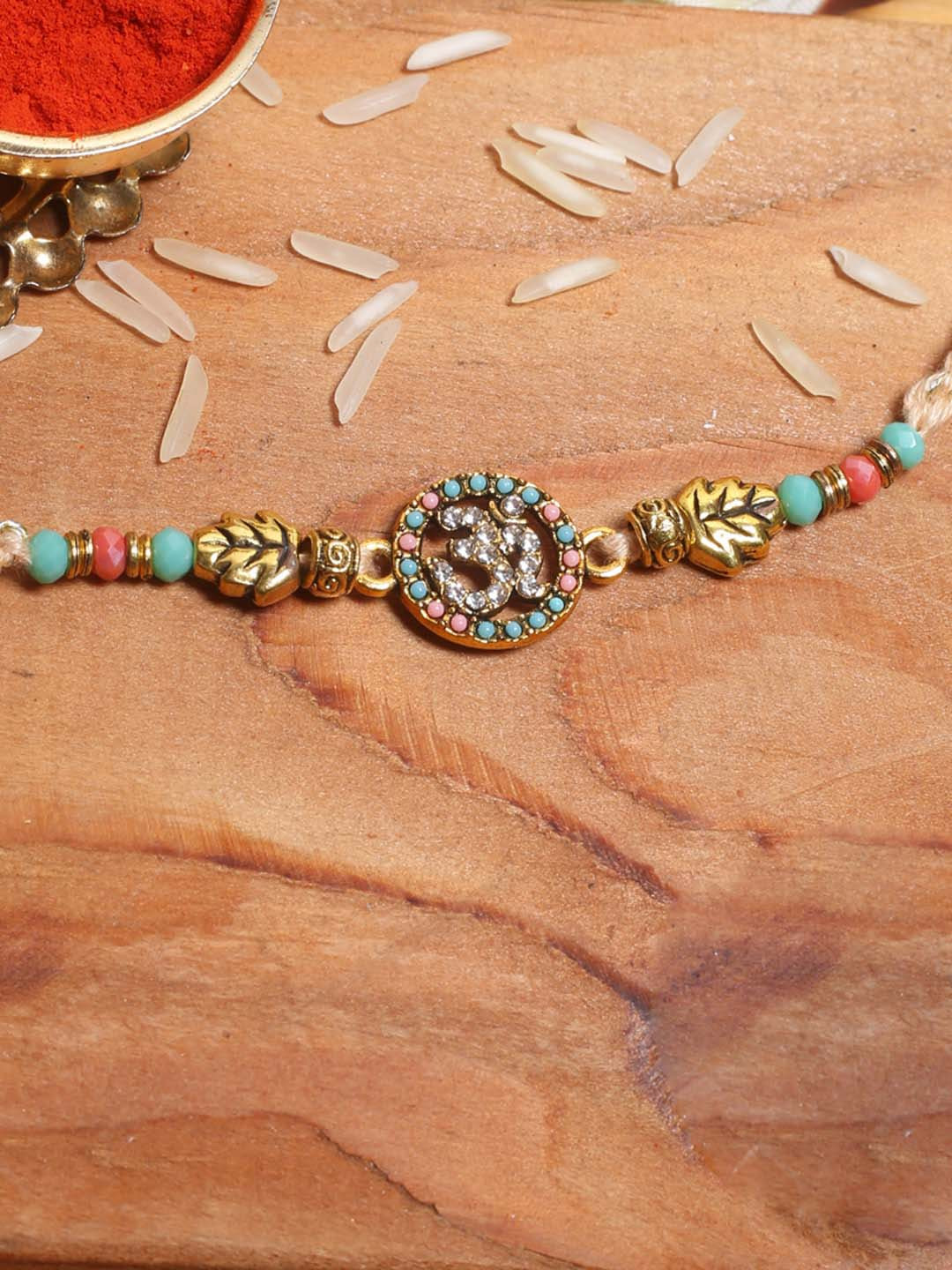 

Aapno Rajasthan Embellished OM Rakhi With Colourful Beads Roli Chawal & Card, Multi