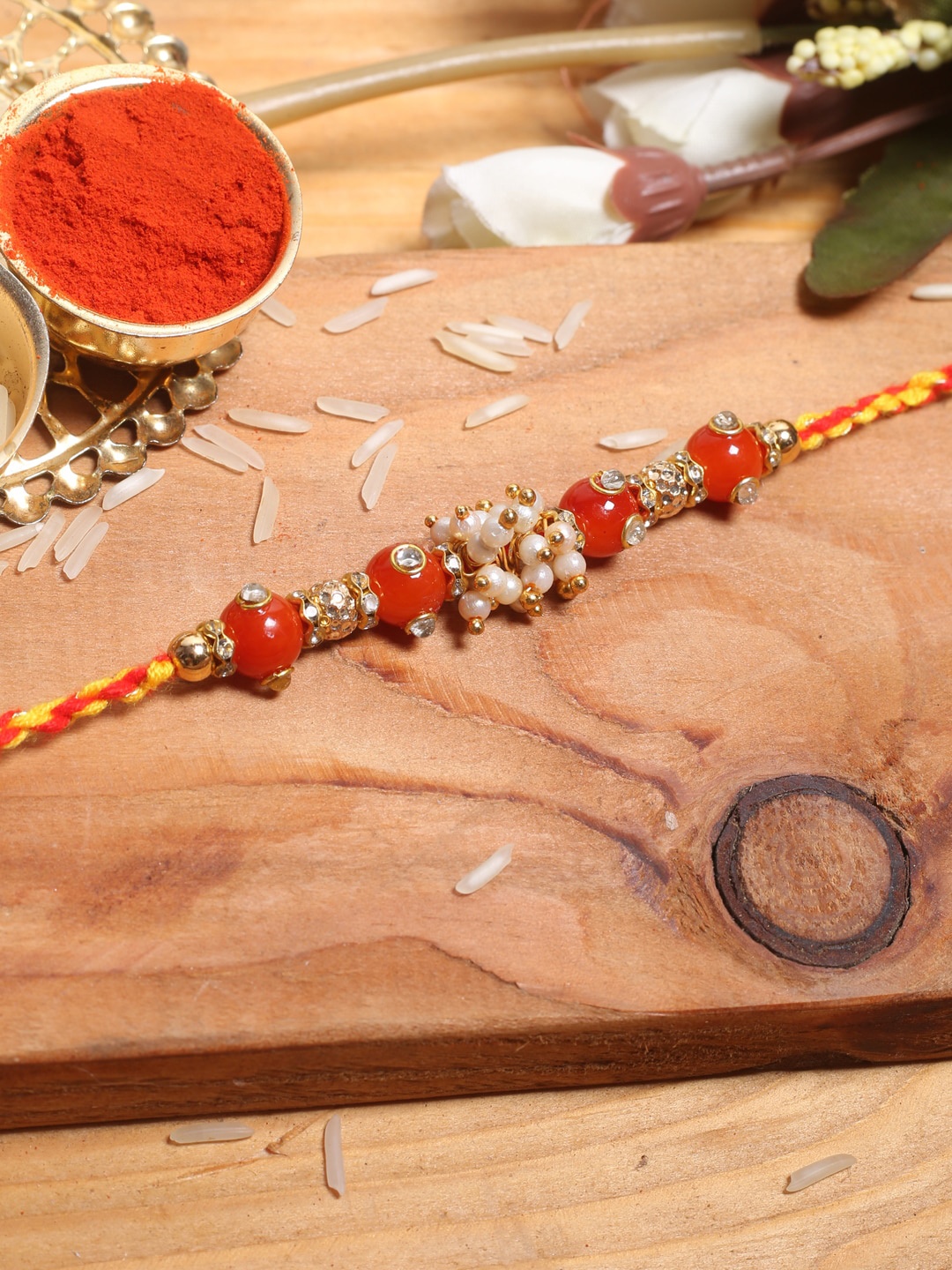 

Aapno Rajasthan Red & White Beaded Mauli Rakhi