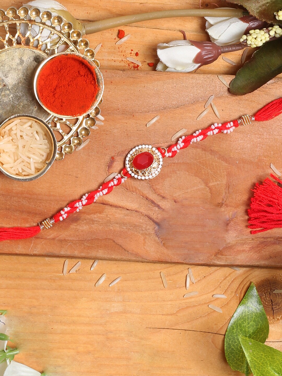 

Aapno Rajasthan Red & White Beaded Rakhi with Red Stone