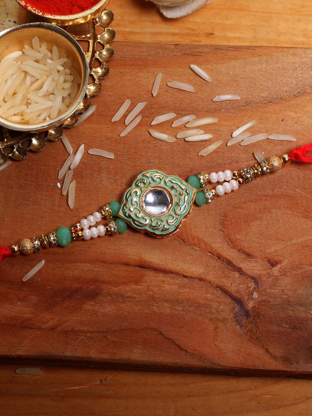 

Aapno Rajasthan Green Textured Beaded Rakhi