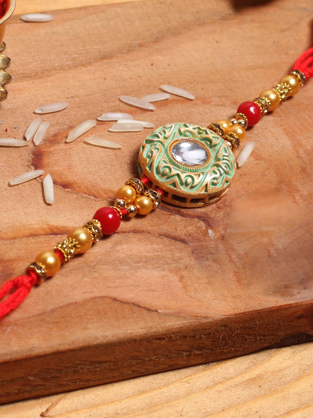 

Aapno Rajasthan Pack of 3 Green Textured Handcrafted Rakhi with Roli Chawal, Multi