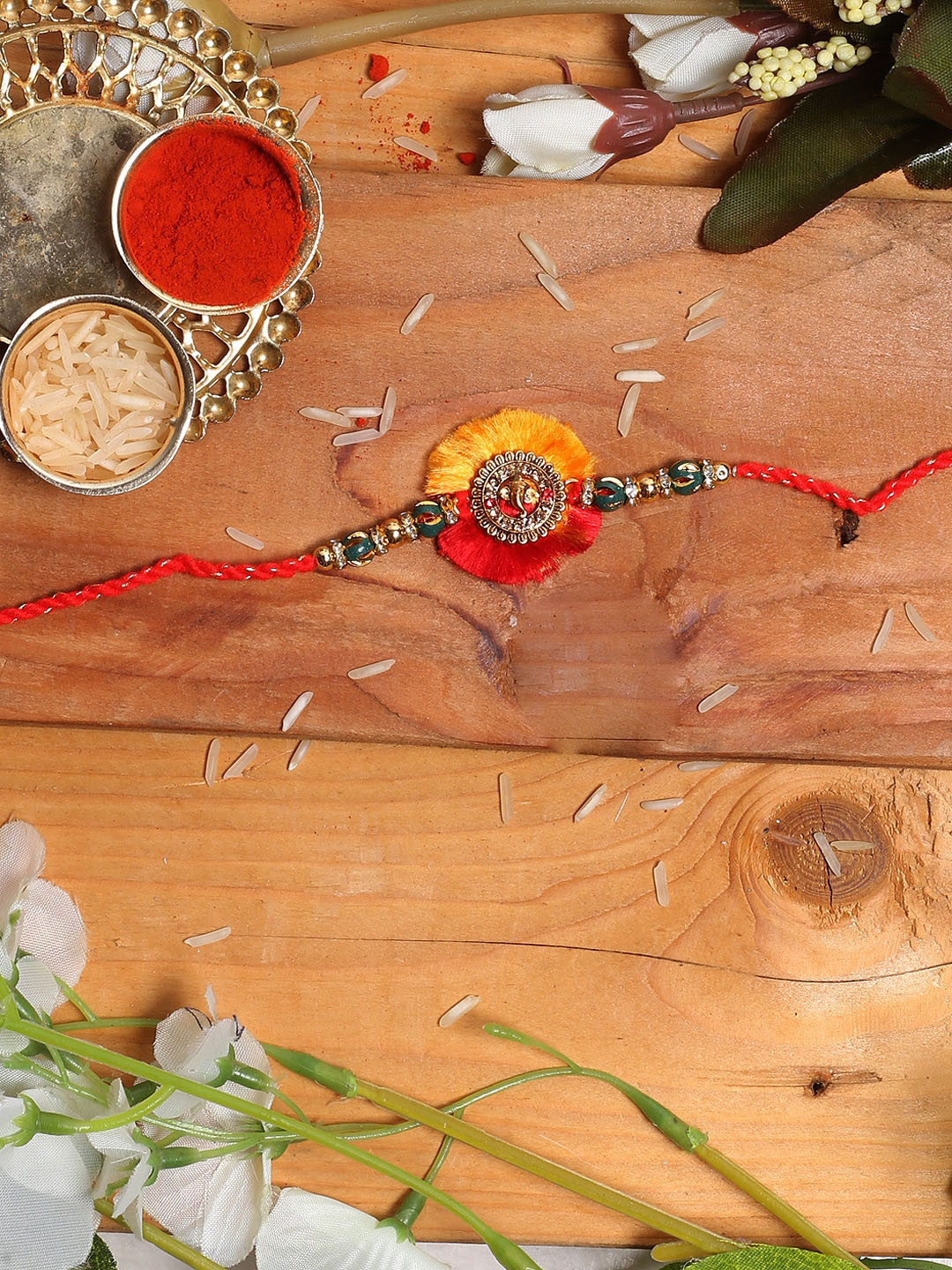 

Aapno Rajasthan Red & Yellow Handcrafted Lord Ganesha Rakhi