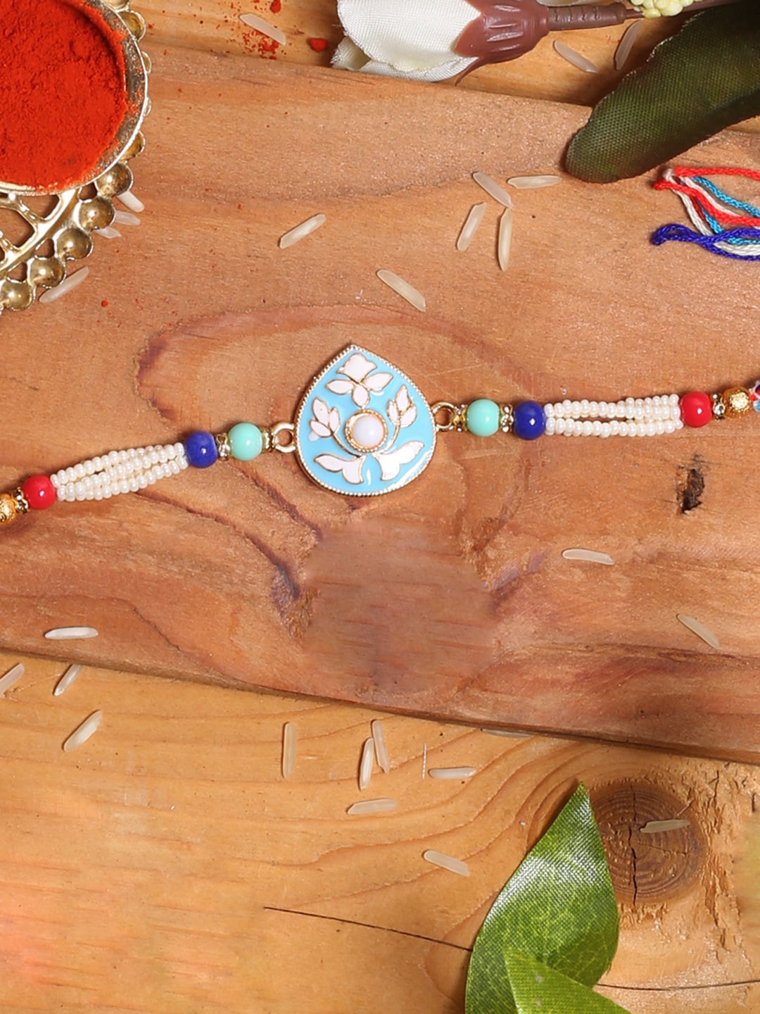 

Aapno Rajasthan Blue Floral Rakhi