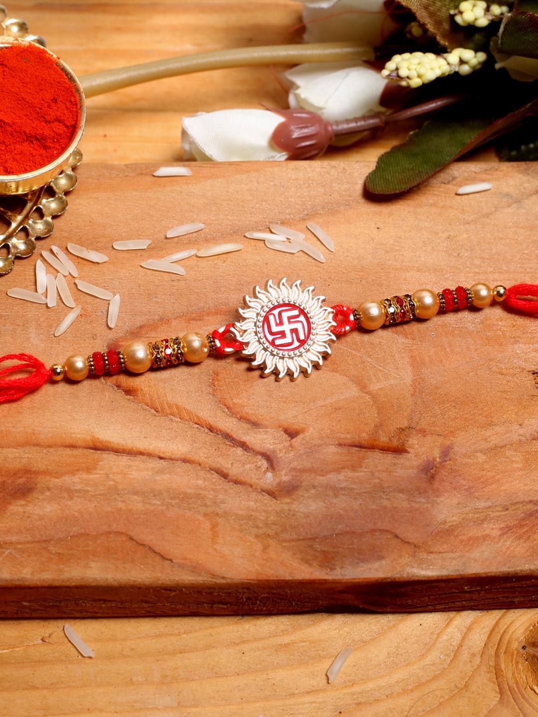 

Aapno Rajasthan Red Swastika in Sun Shaped Rakhi