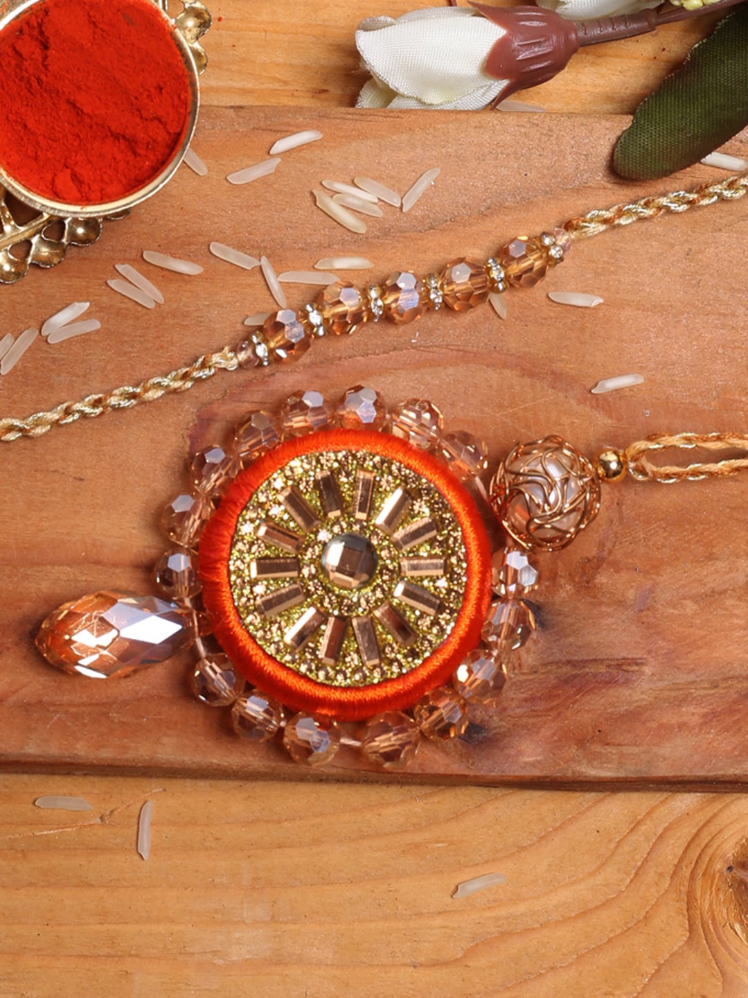 

Aapno Rajasthan 2 Pieces Orange Portrait Bhaiya Bhabhi Rakhi Combo