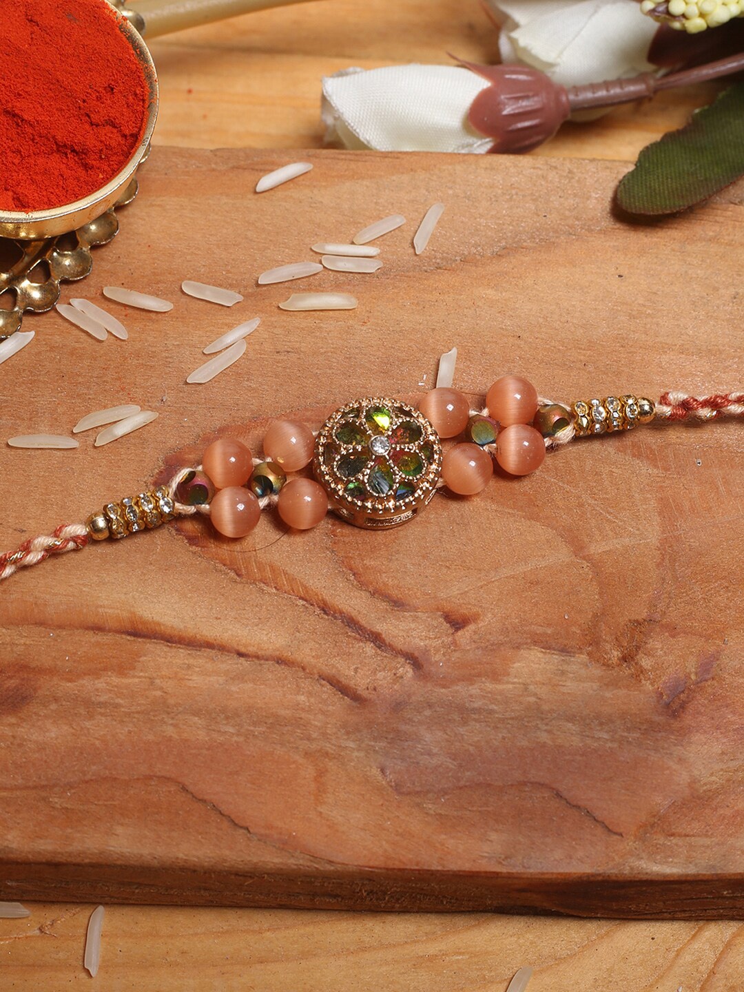 

Aapno Rajasthan Brown Floral Rakhi