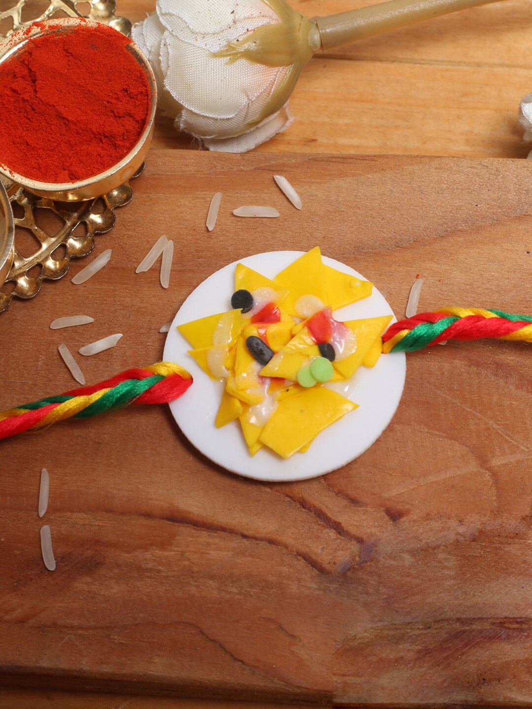 

Aapno Rajasthan Kids Multicoloired Cheesy Nacho Platter Rakhi, Multi
