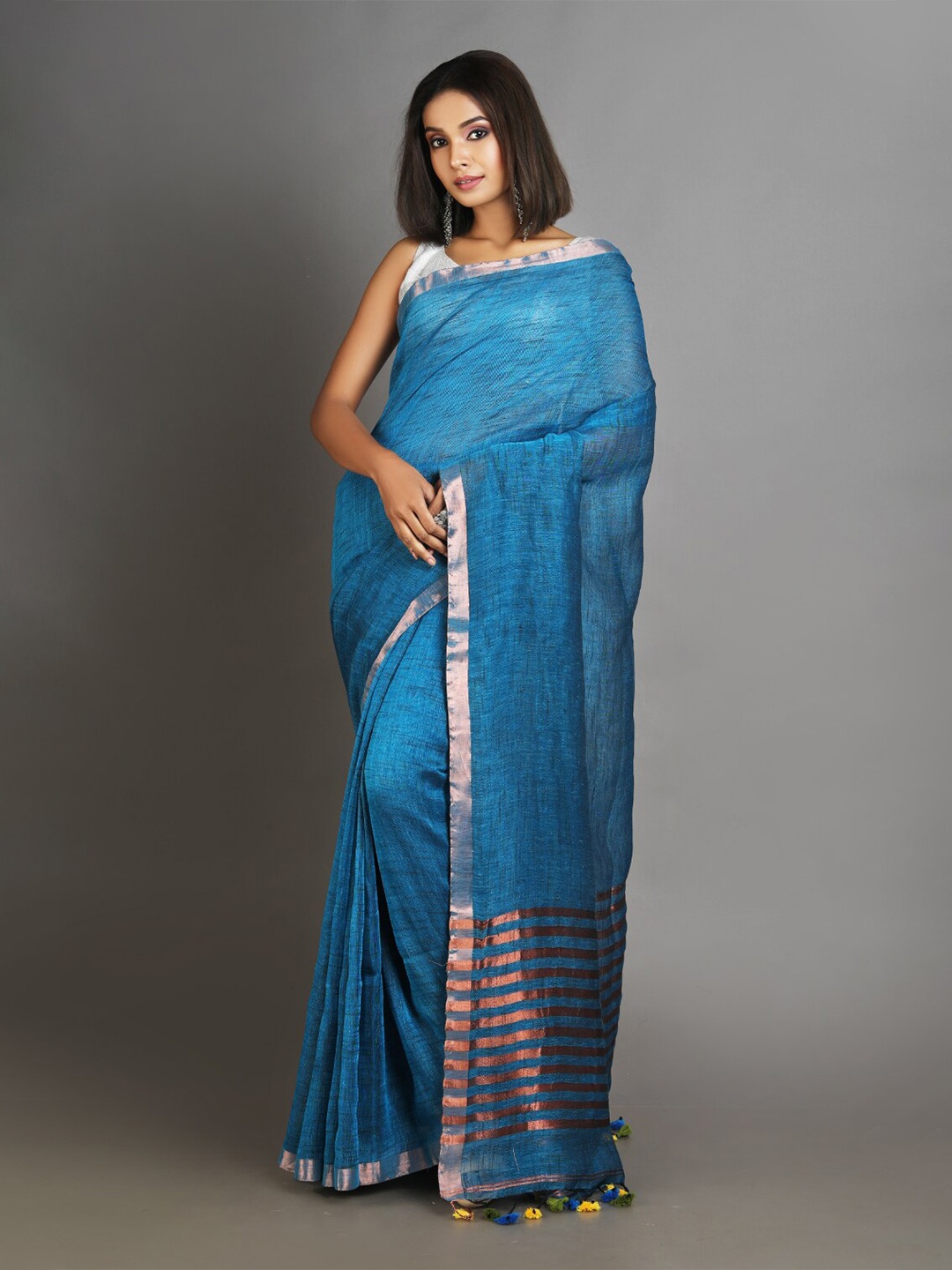 

Charukriti Teal & Gold-Toned Zari Pure Linen Saree