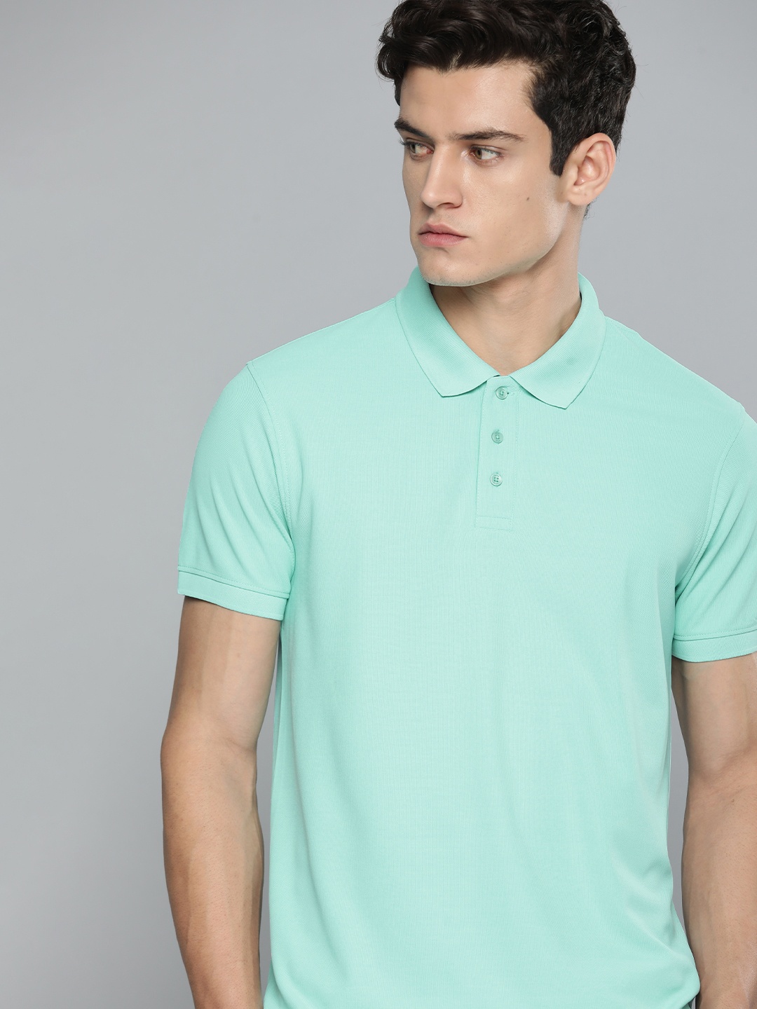 

ether Men Sea Green Solid Polo Collar T-shirt