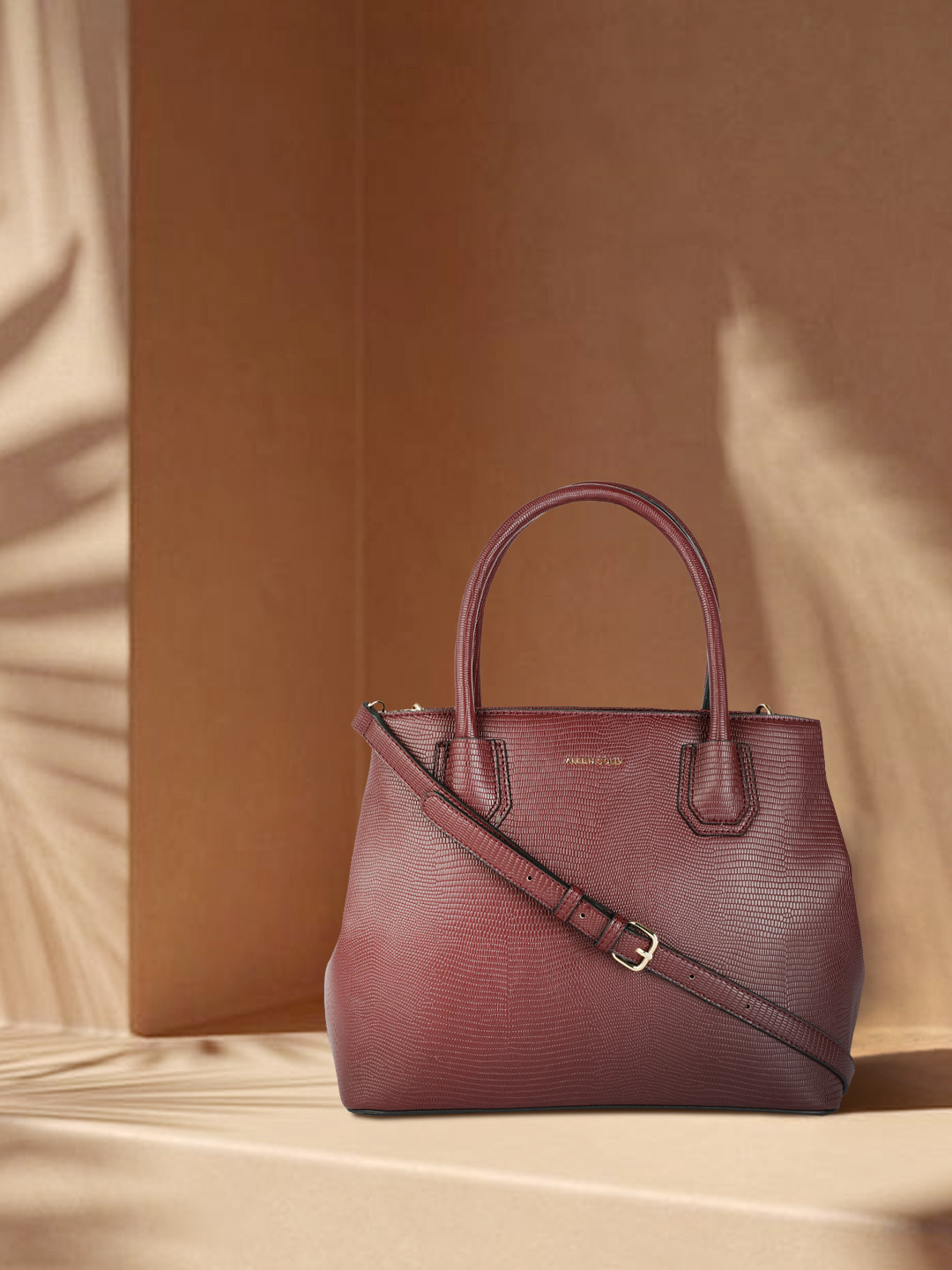 

Allen Solly Maroon Textured Handheld Bag