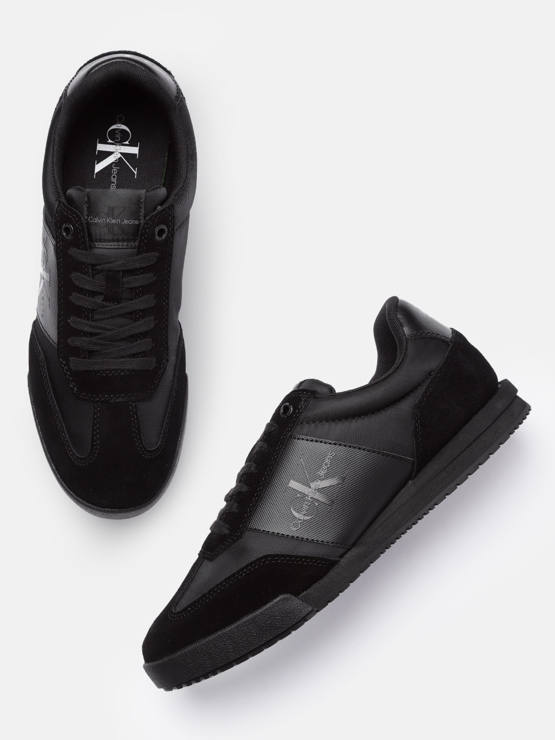 

Calvin Klein Men Black Solid Leather Sneakers