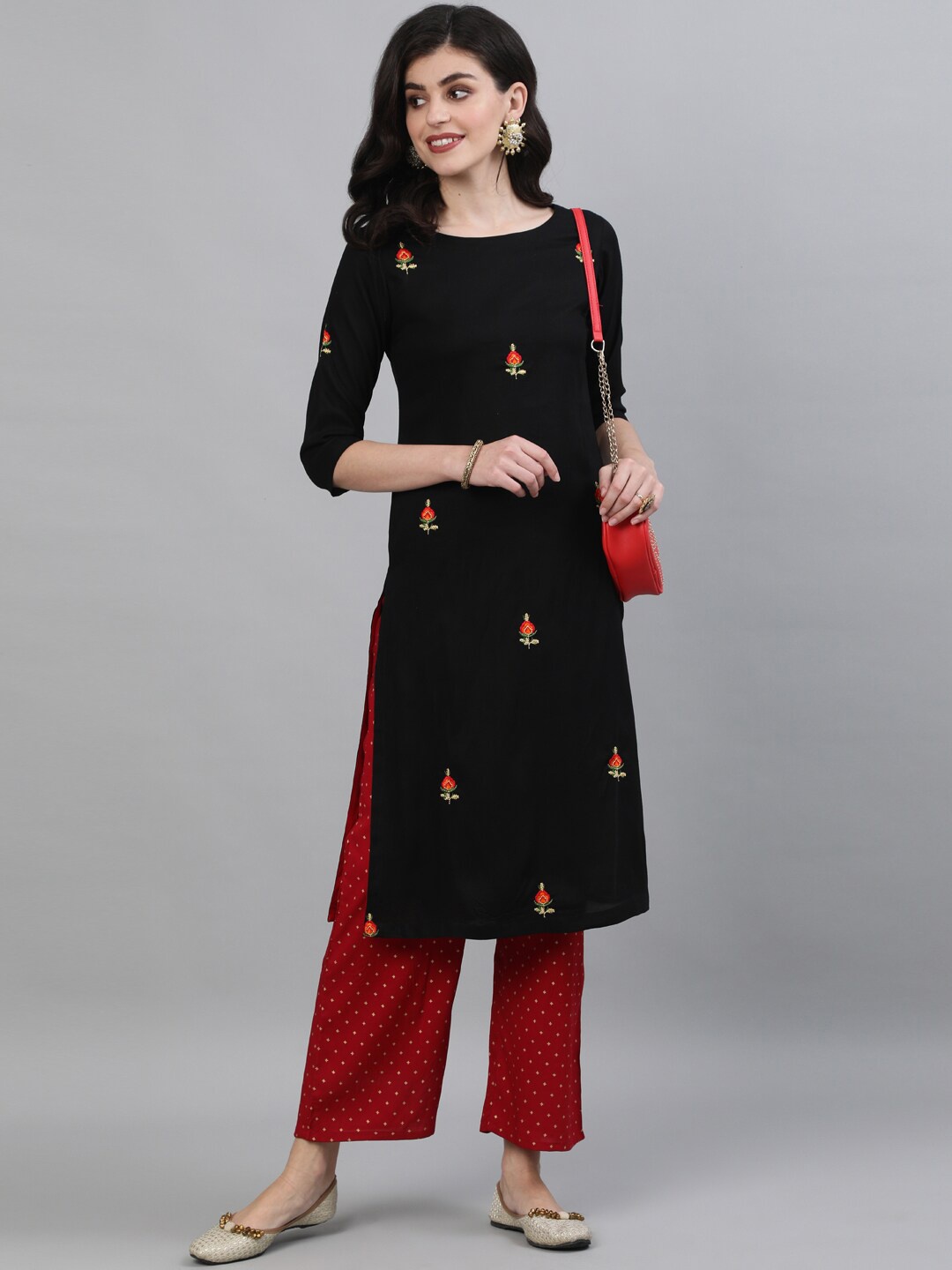 

KIMAYRA Women Black Embroidered Panelled Kurti with Trousers